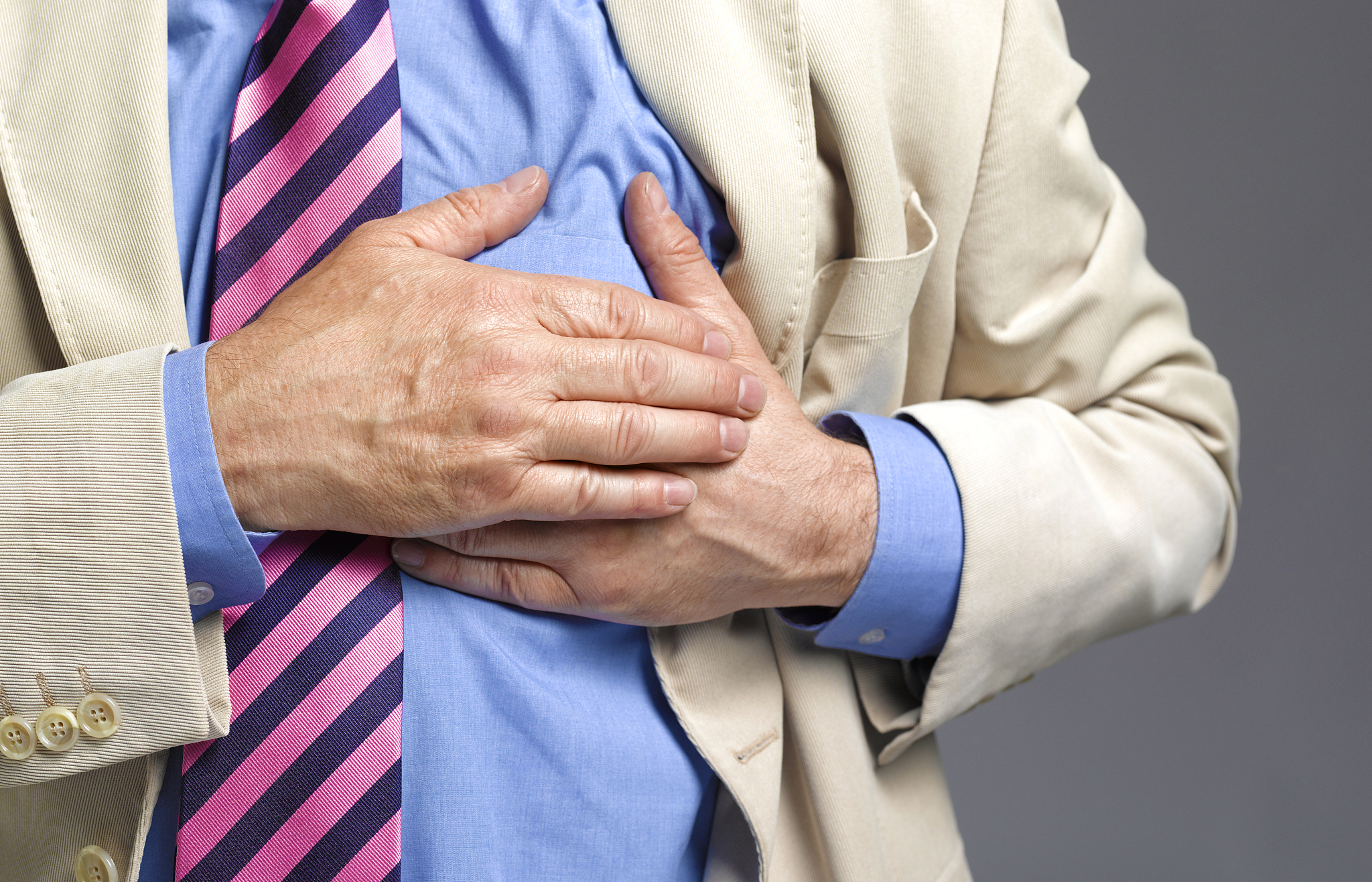 senior man having a stroke/heart attack