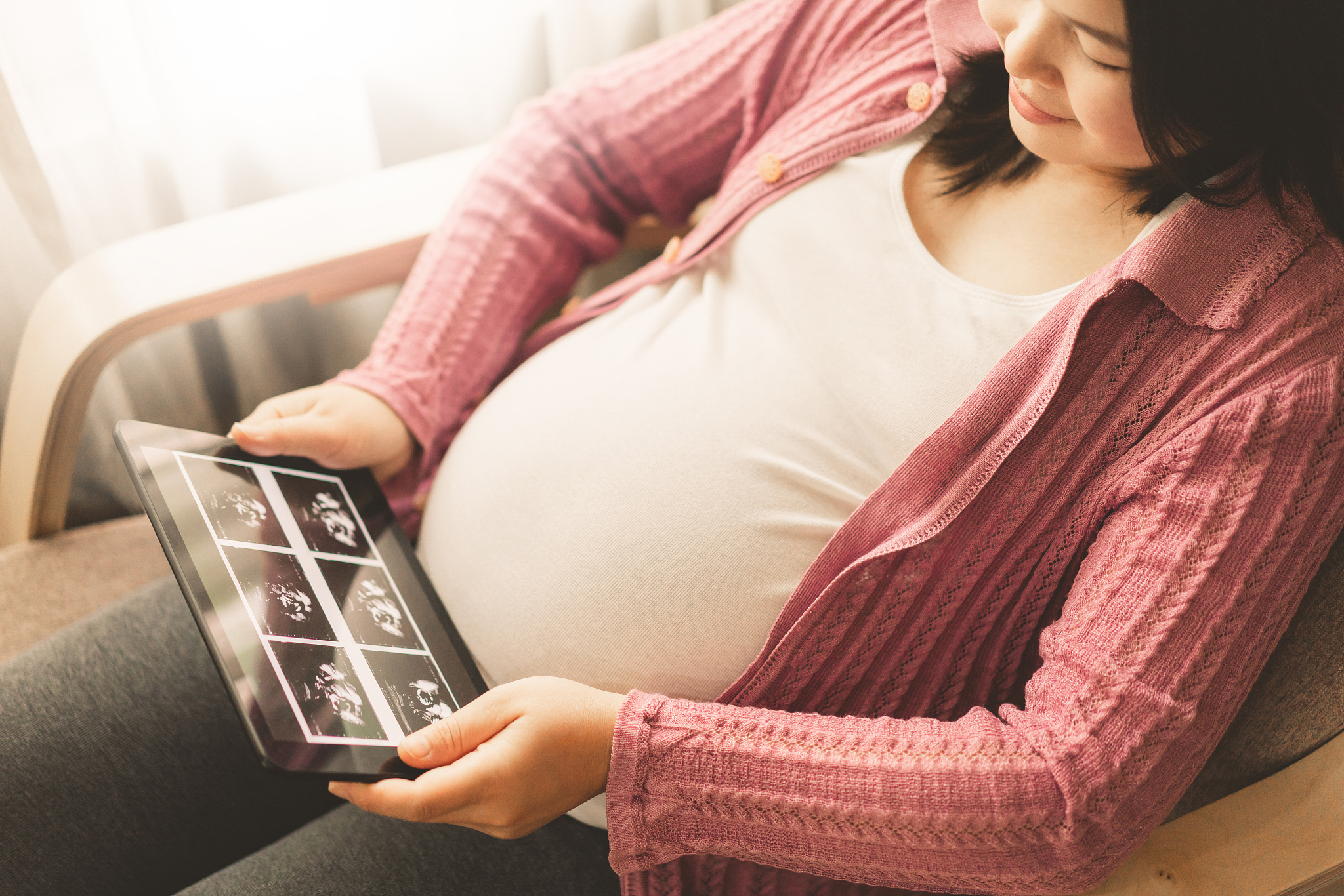 happy pregnant woman and expecting baby at home.