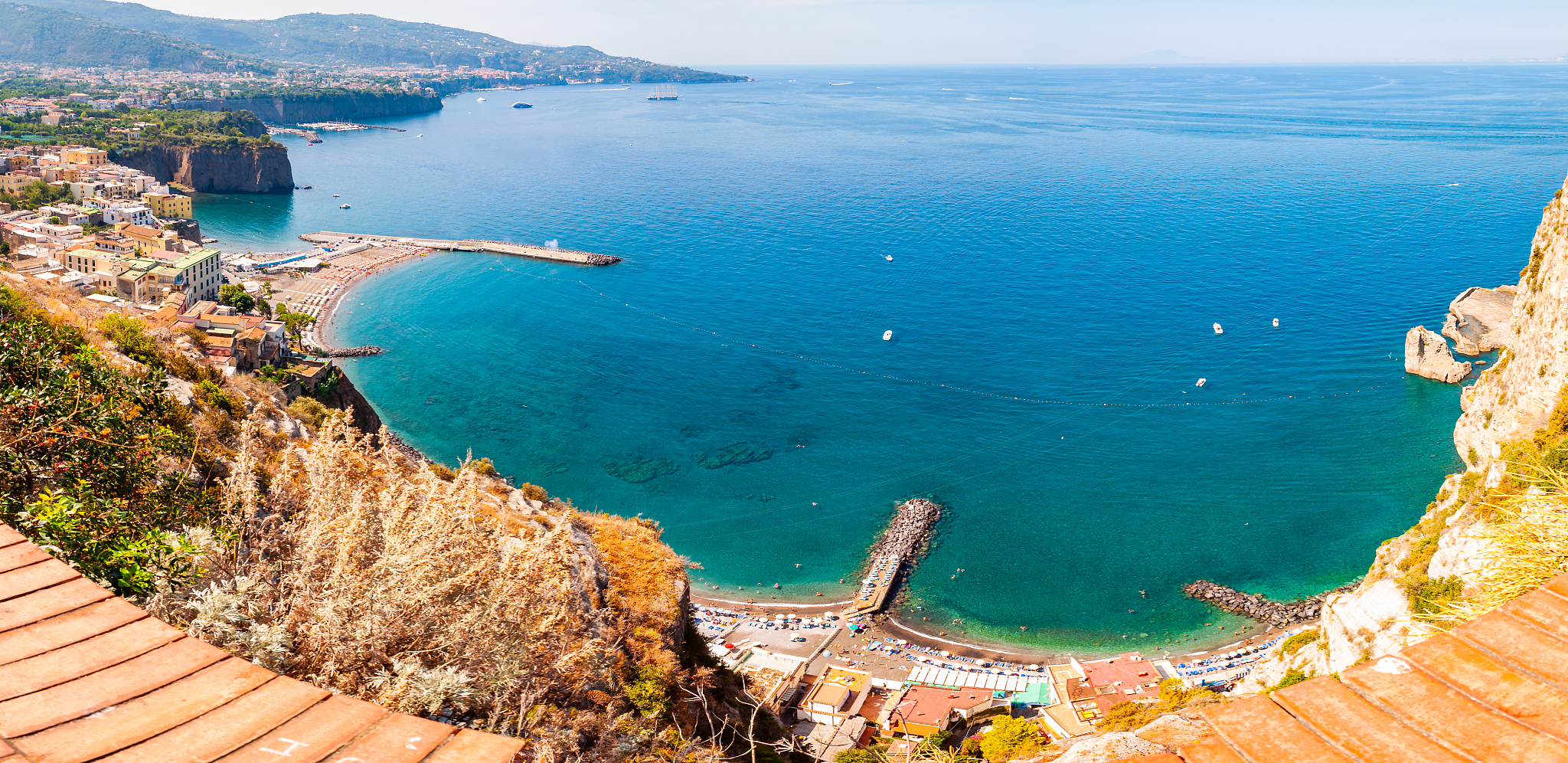 panorama of high cliffs, tyrrhenian sea bay with pure azure wate