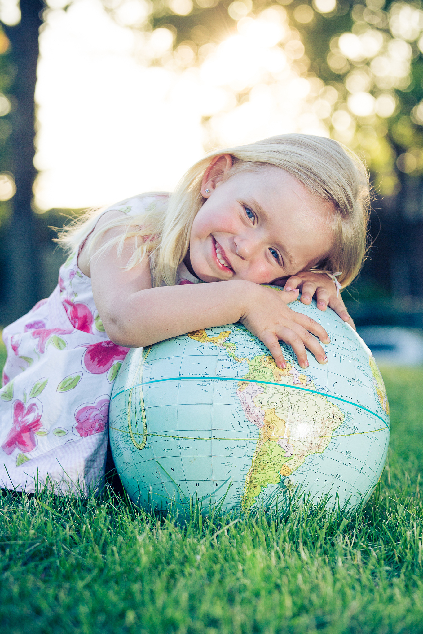 young girl with globe