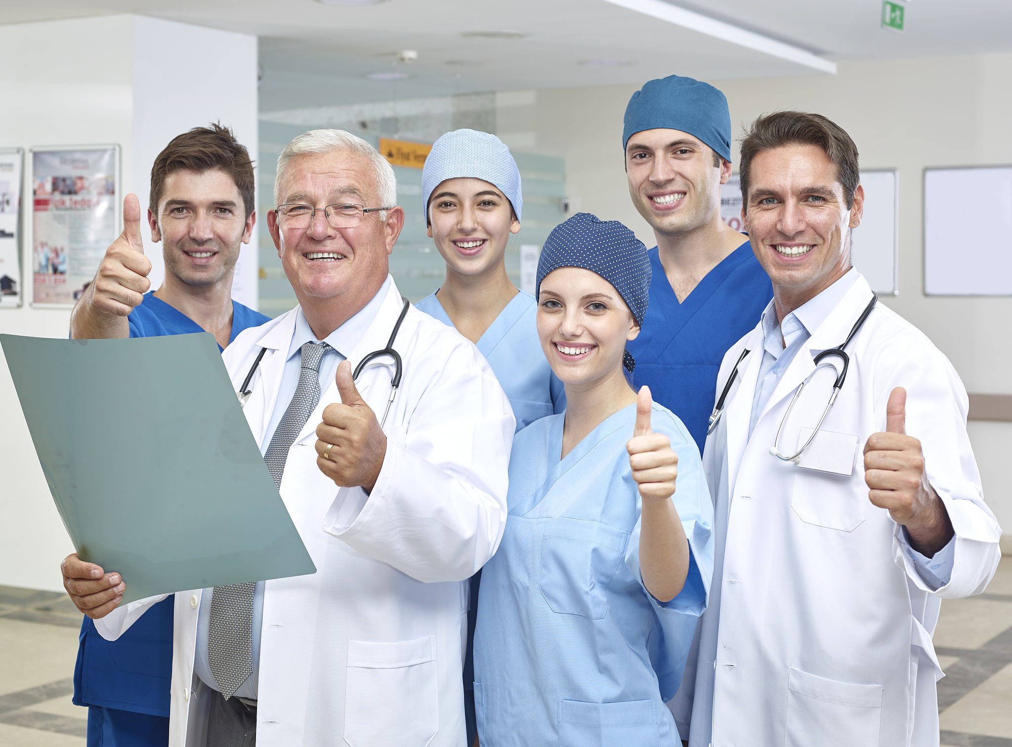 group of doctors signing to confirm