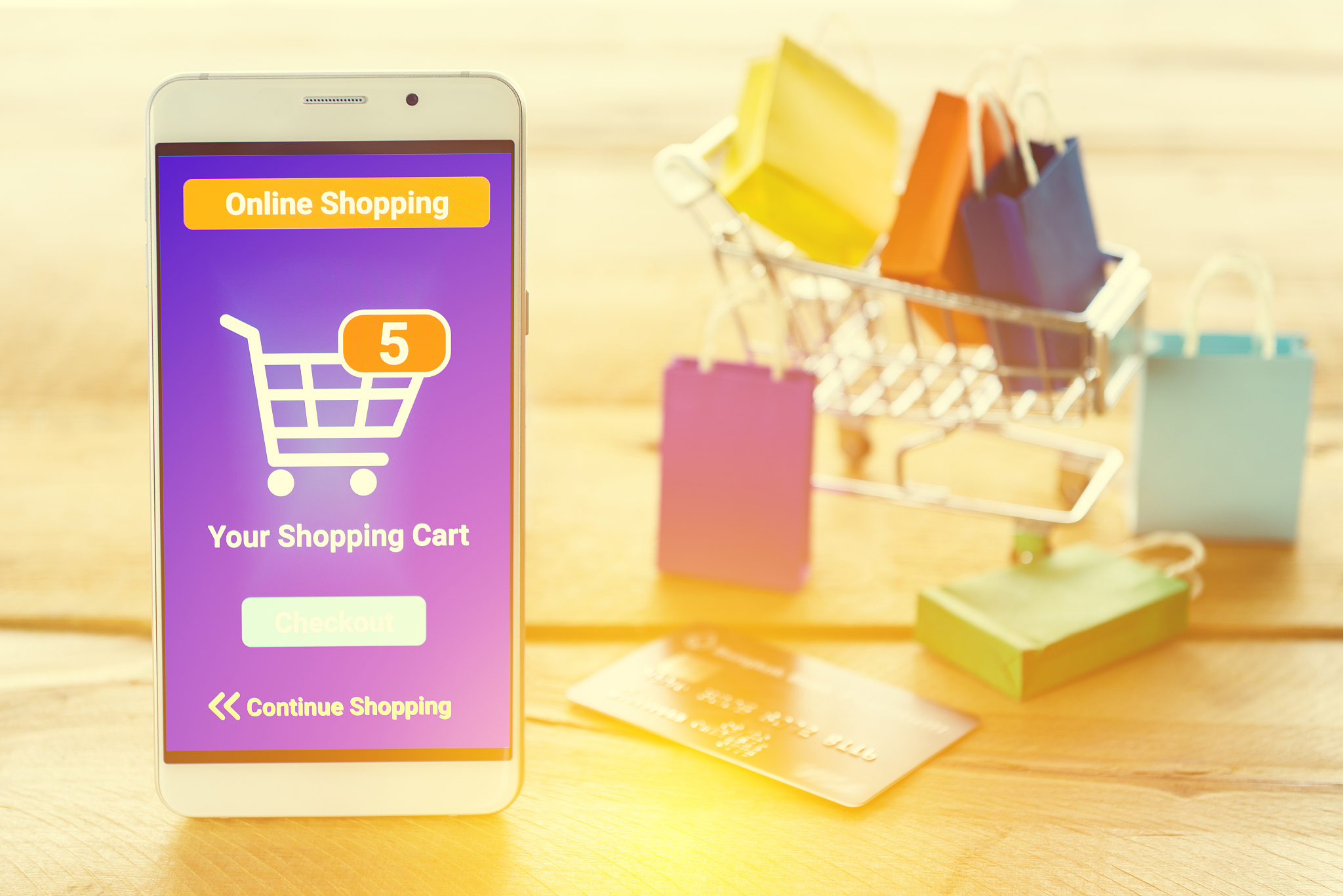 white smart device shows an online shopping screen app.