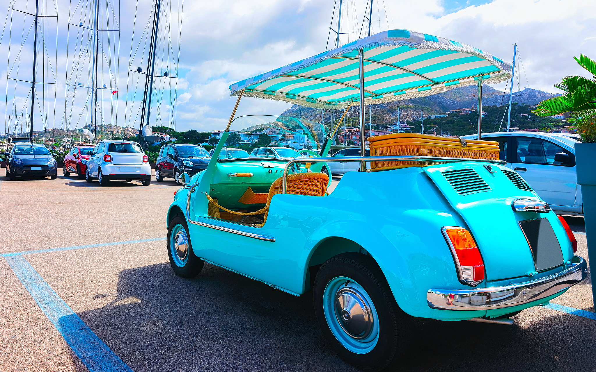 golf cart in parking at porto cervo sardinia reflex