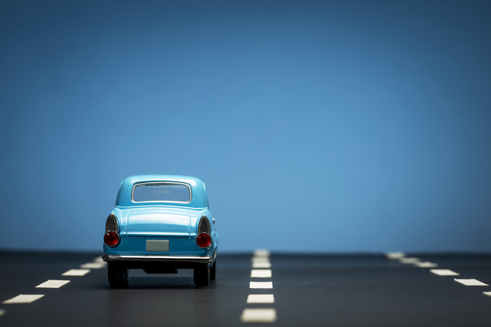 blue toy car on a blue background.