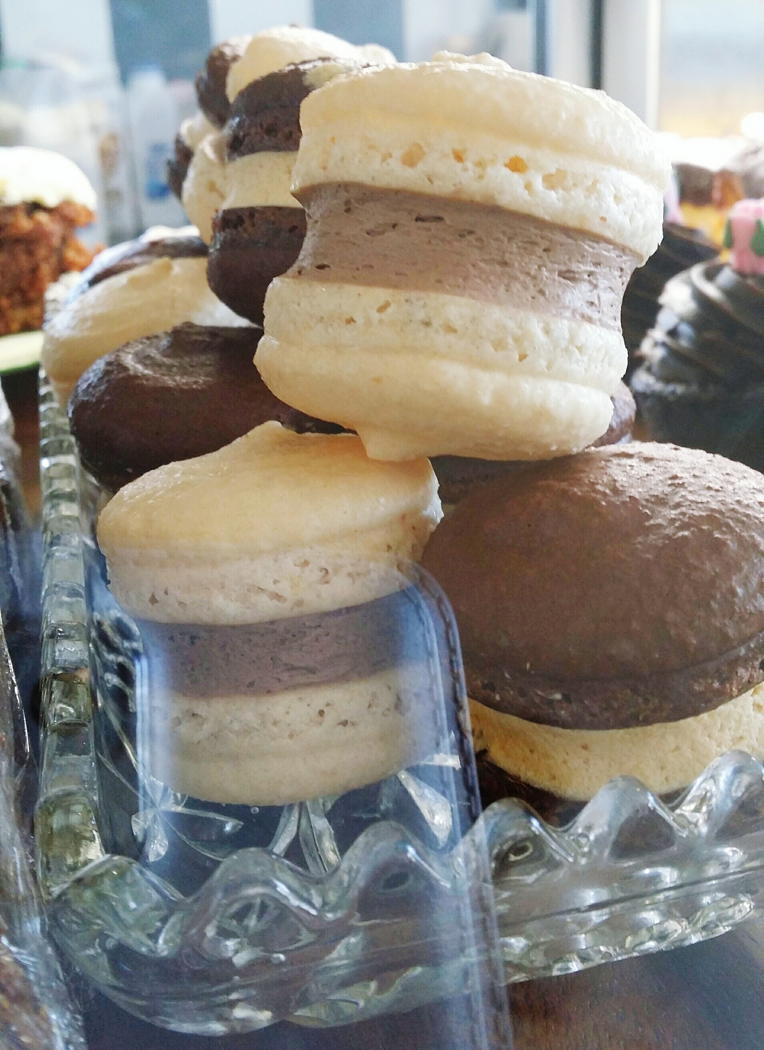close-up of macaroons displayed at bakery