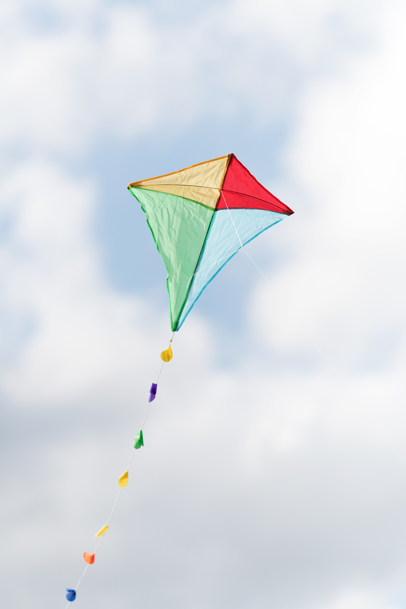 colorful kite in a cloudy sky