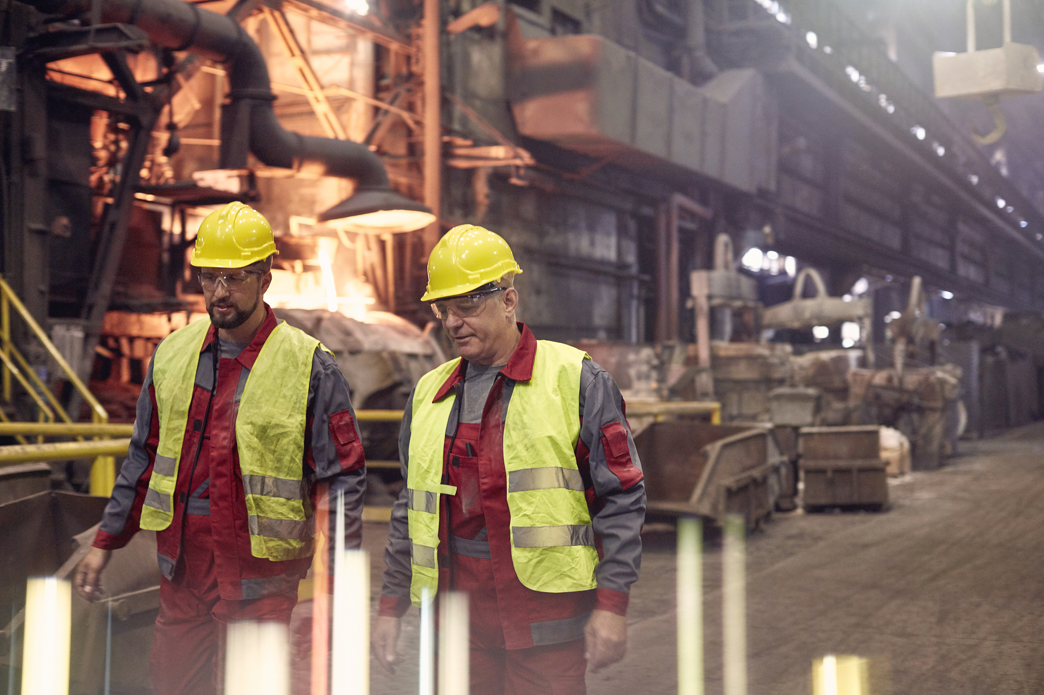 steelworkers walking in steel mill