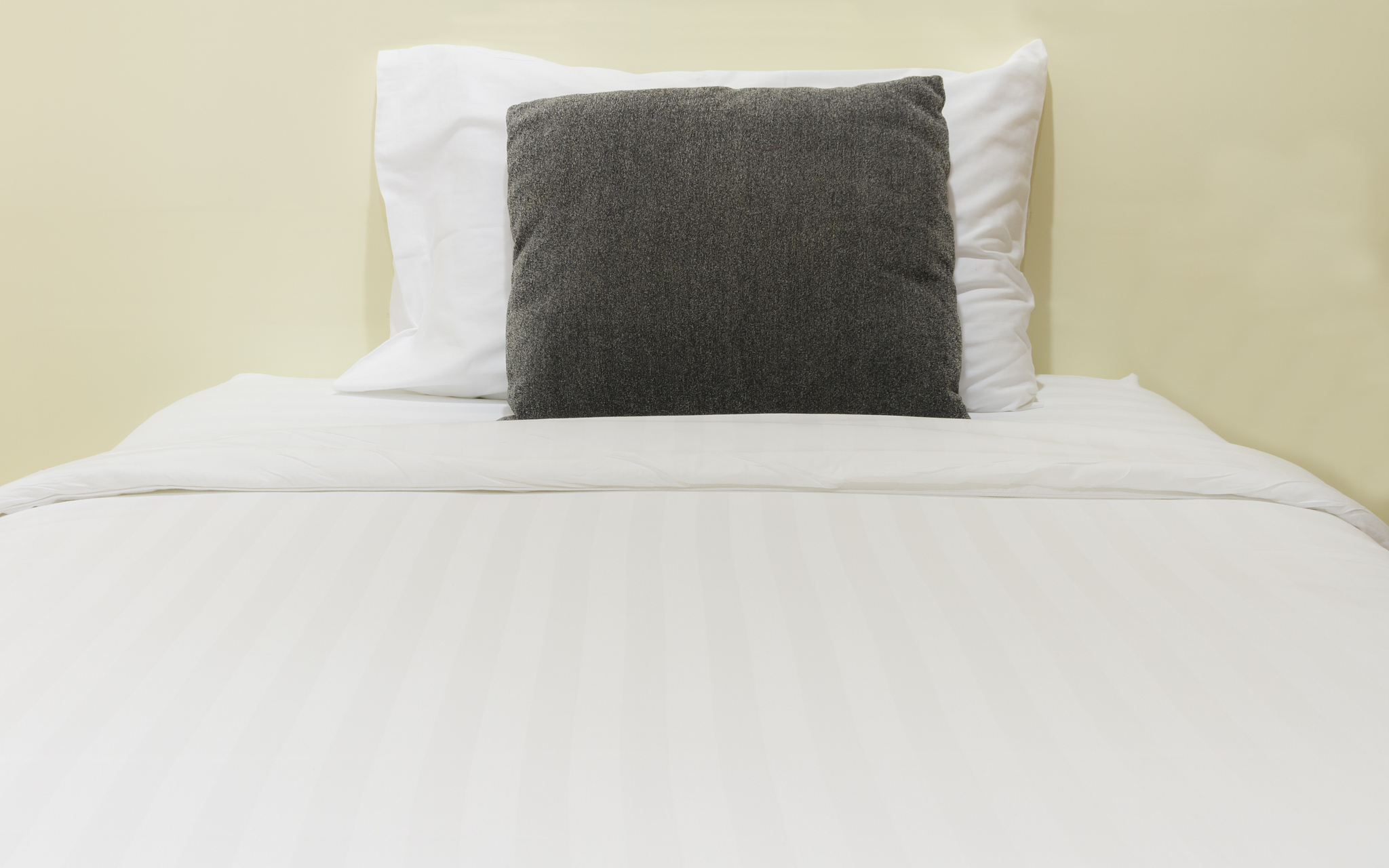 white bed sheets and pillows.