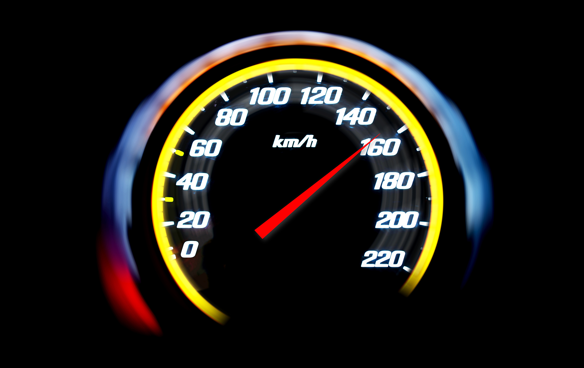 high speed on a car speedometer and motion blur.