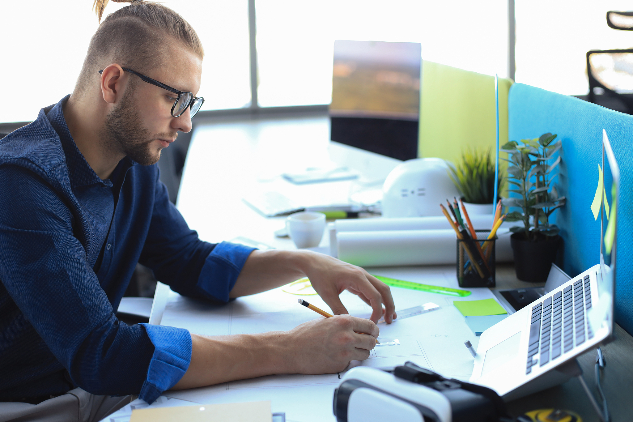 young businessman drawing something while working in the office.