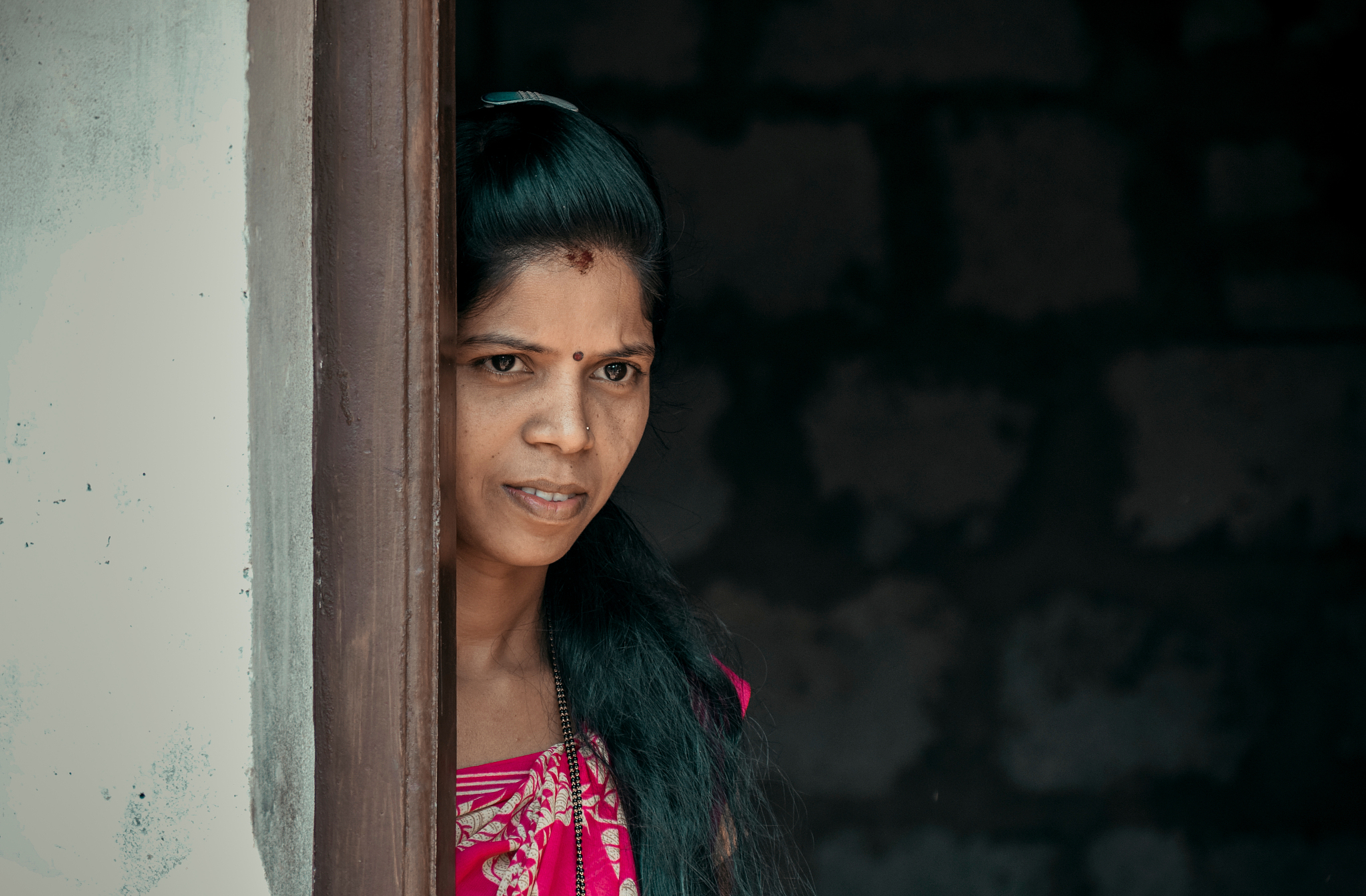 close-up of woman standing on doorway