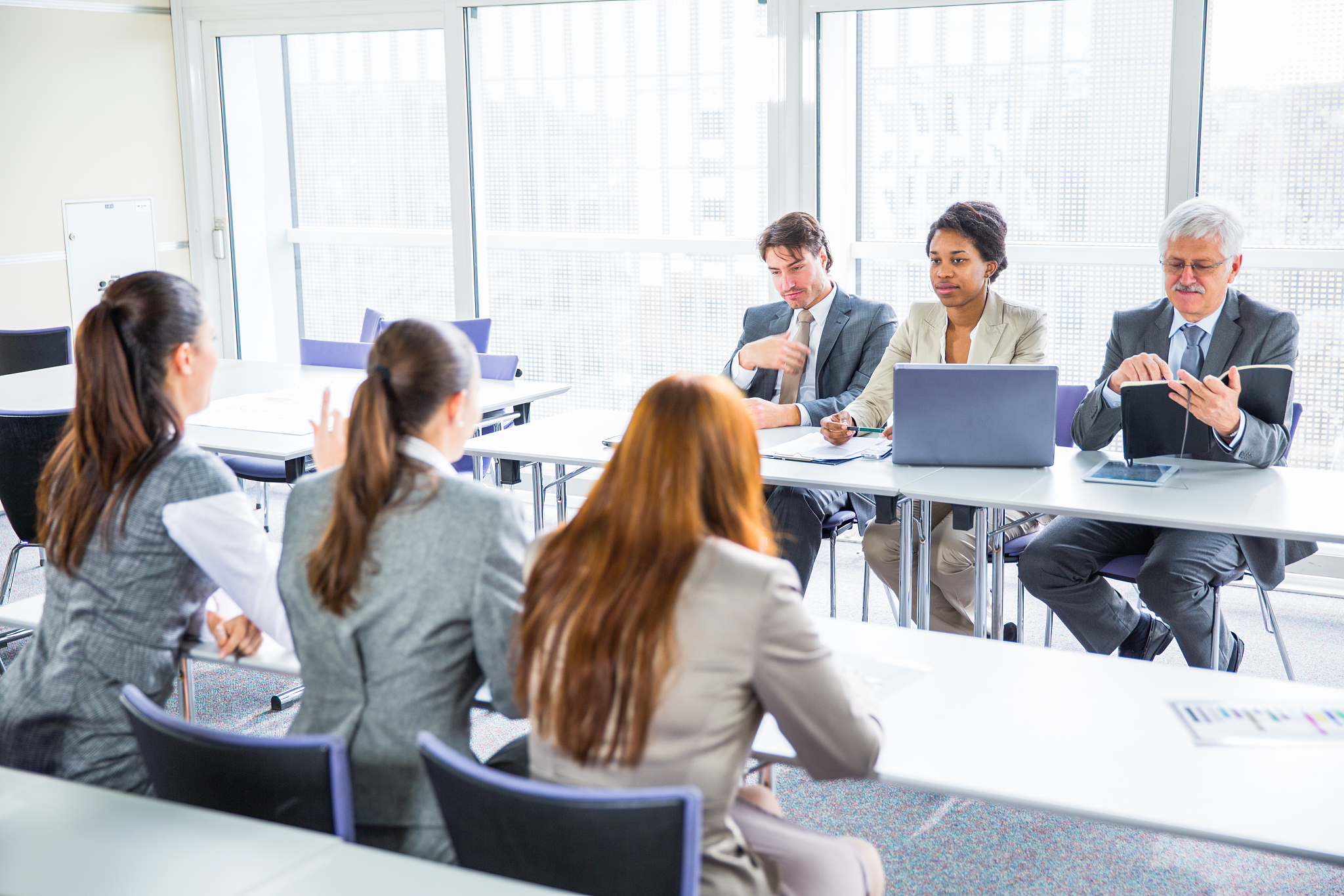 business people in education room talking about their problems