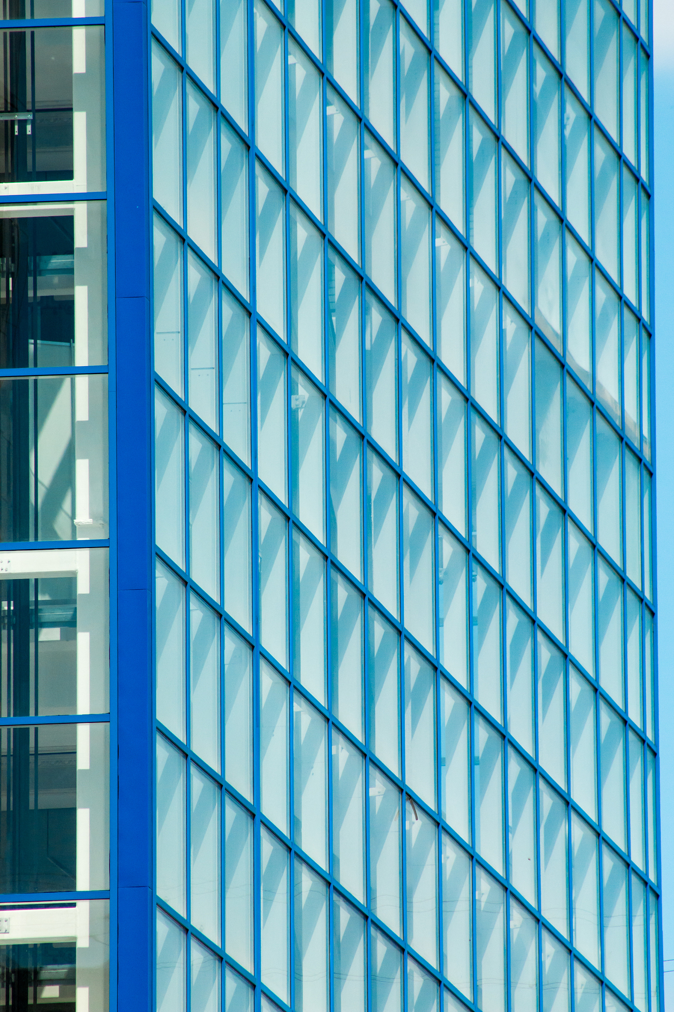 the facade of a modern glass and metal building.
