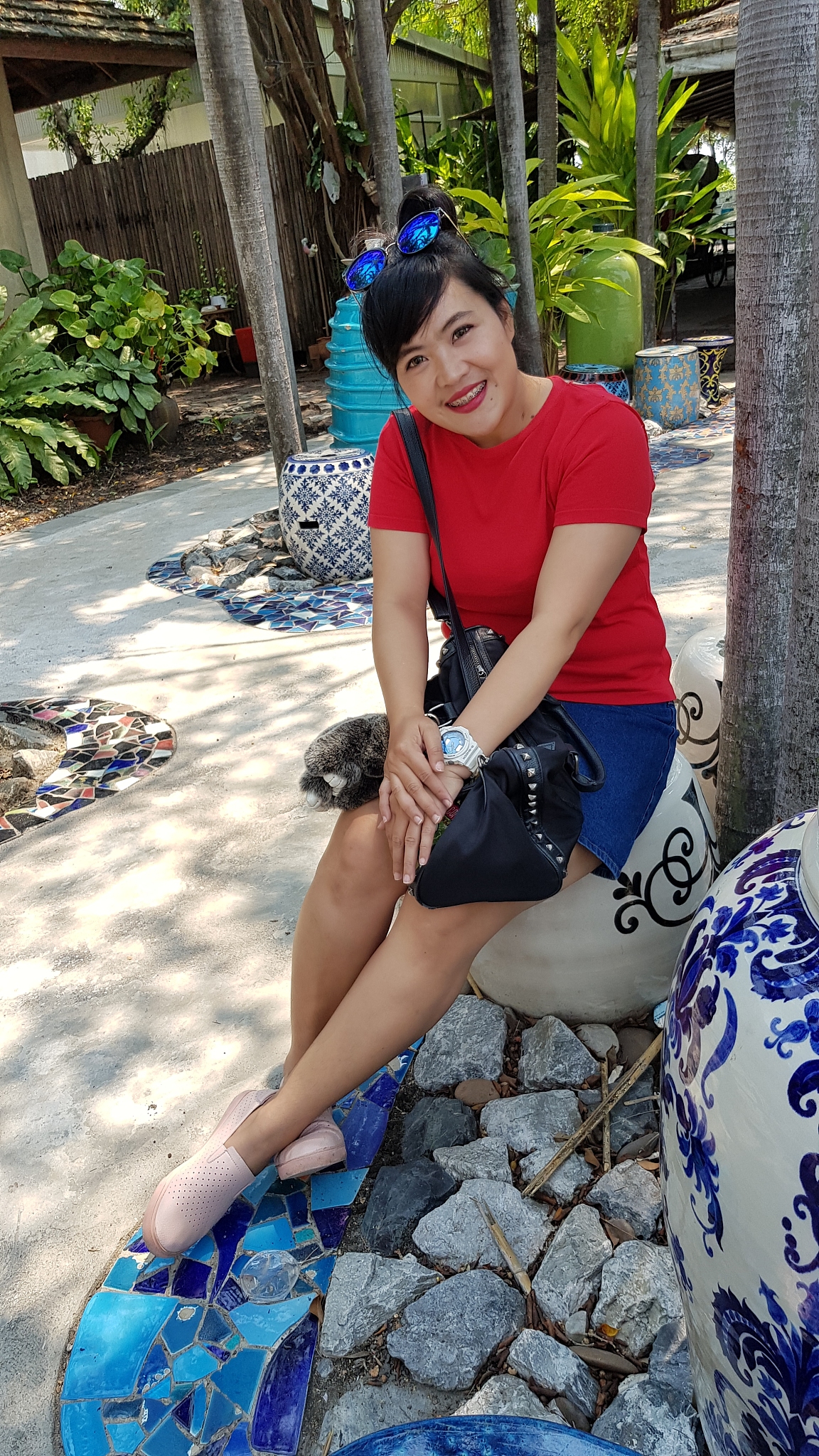 portrait of young woman sitting on seat