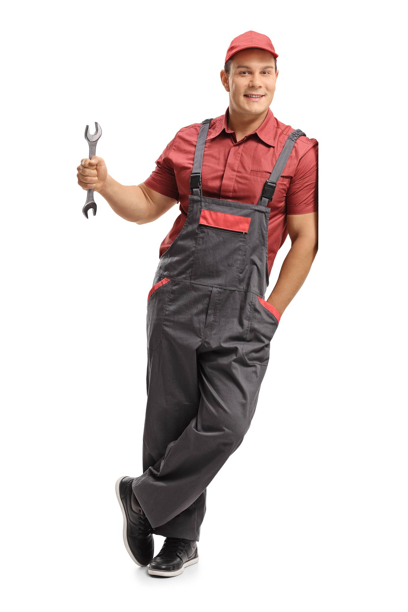 repairman holding a wrench and leaning against a wall