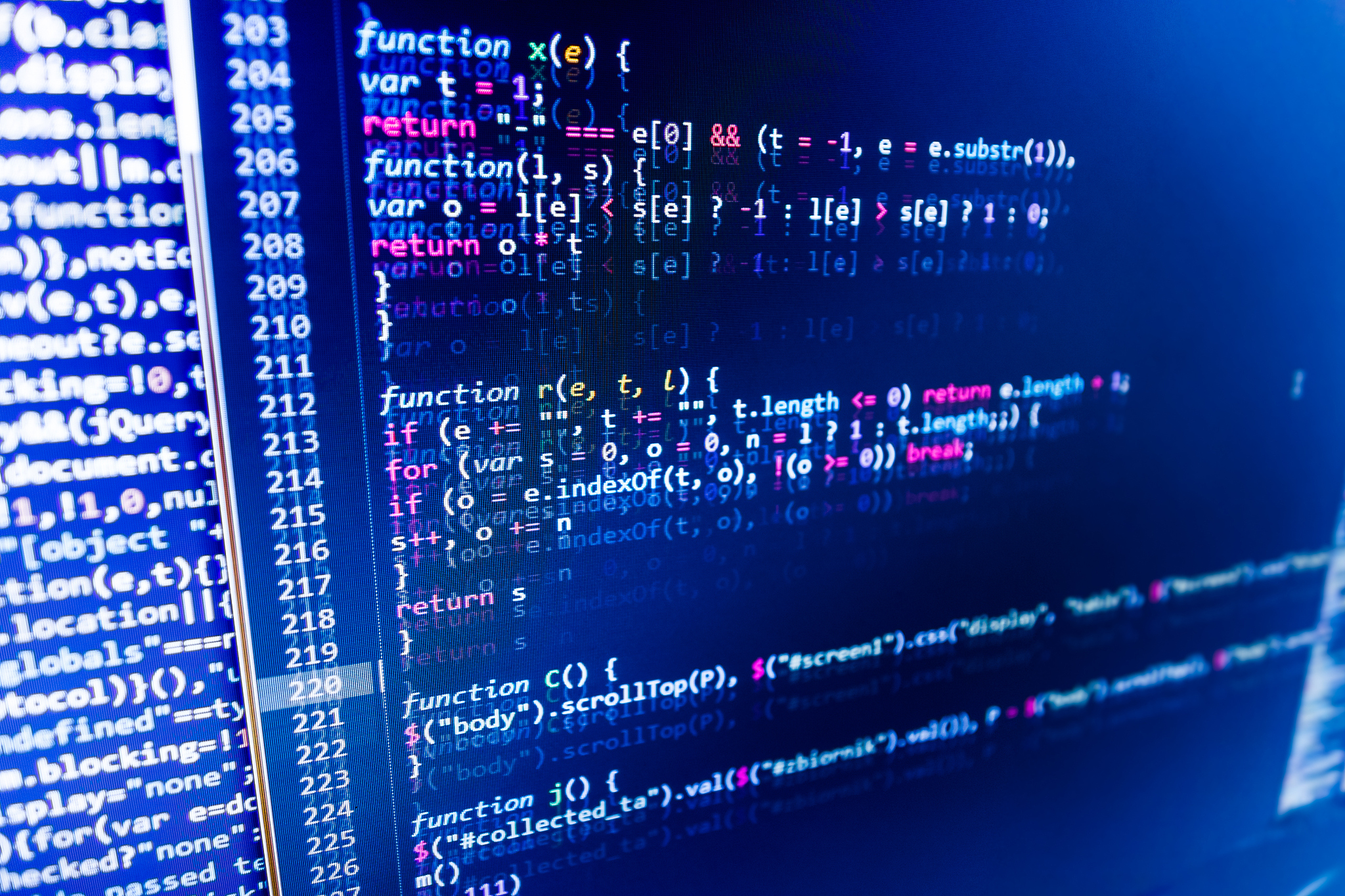 software developer programming code on computer