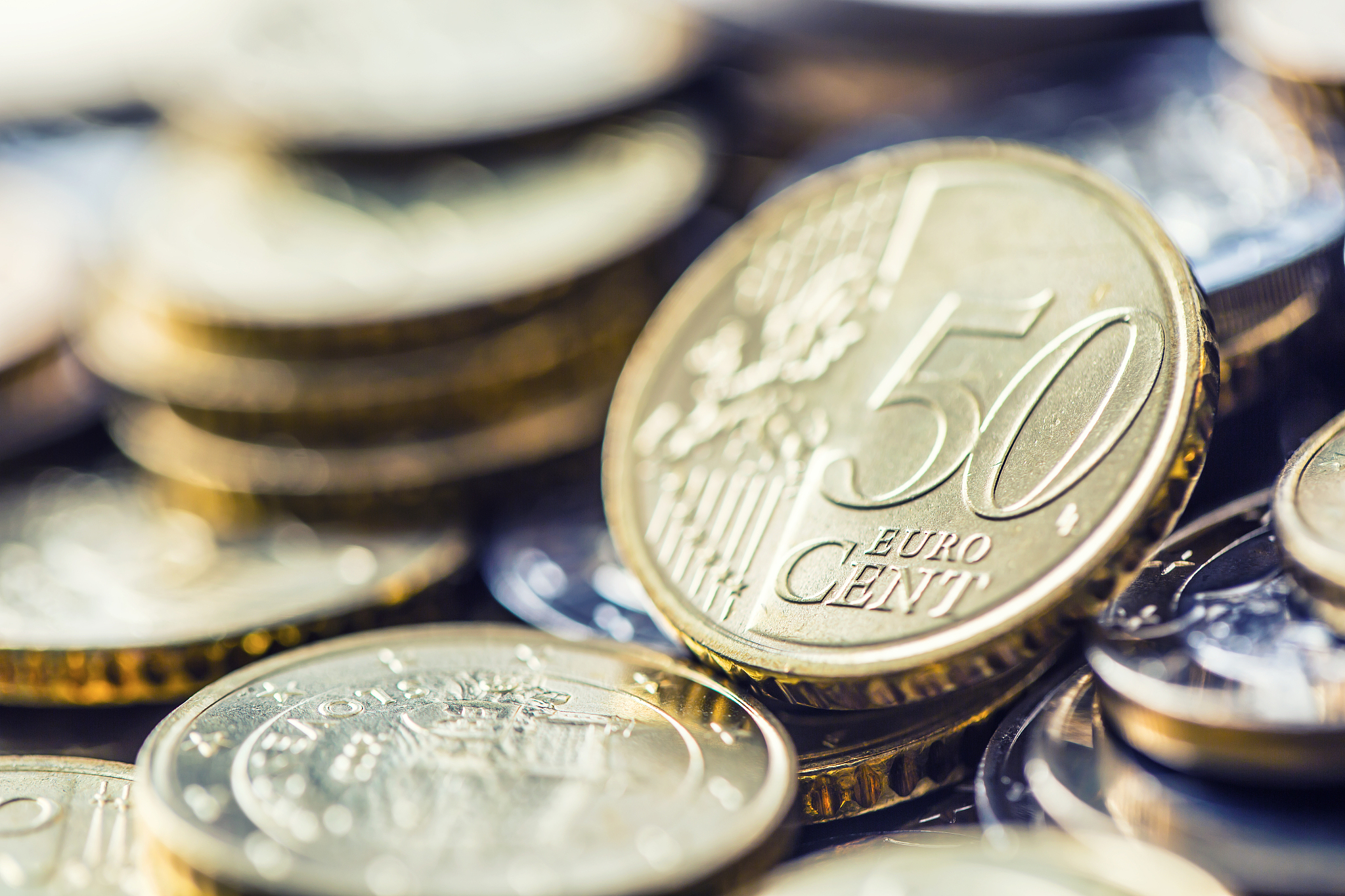 close-up a pile of new euro coins in other compositions