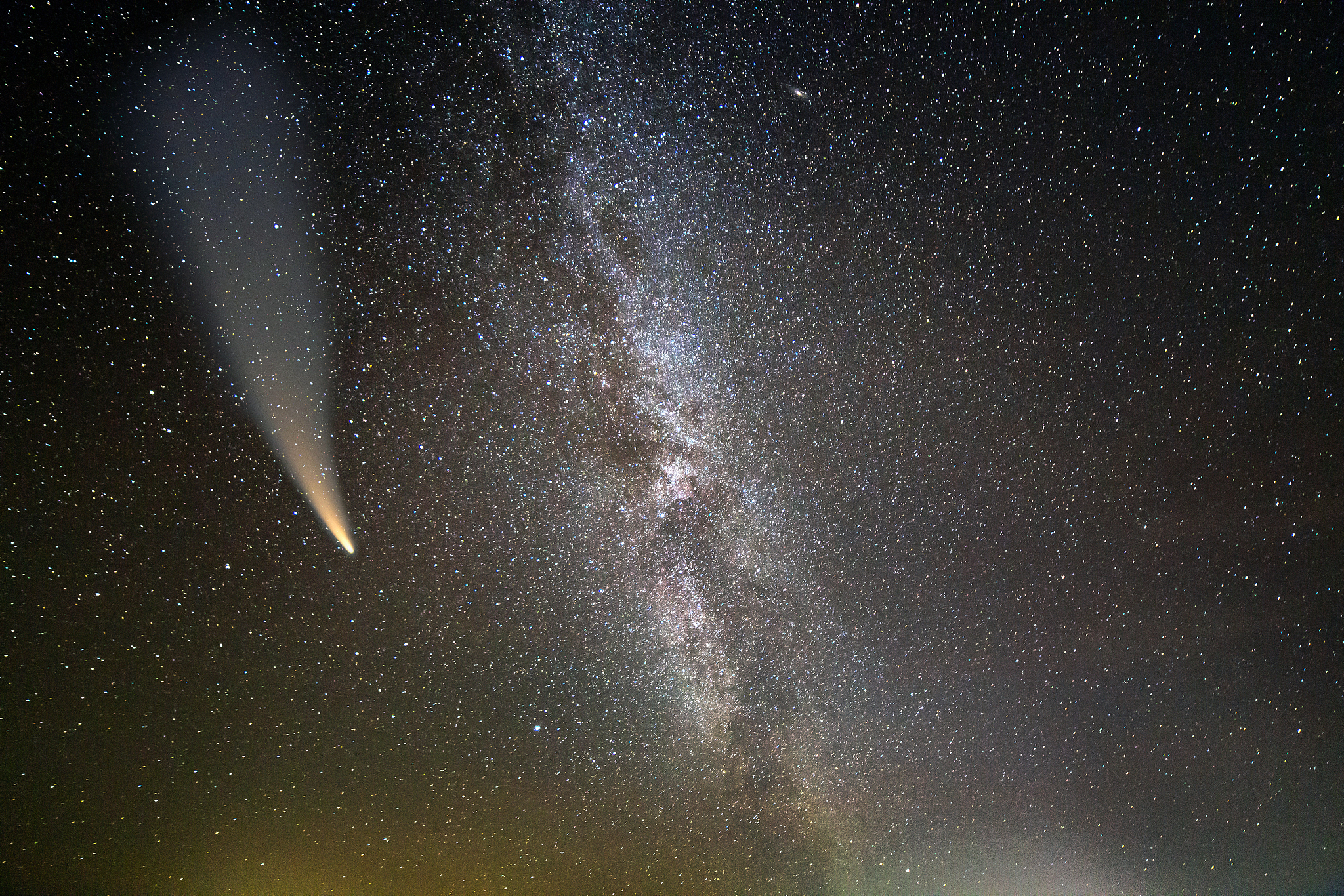 night landscape of milkyway with stars covered sky and c/2020 f3