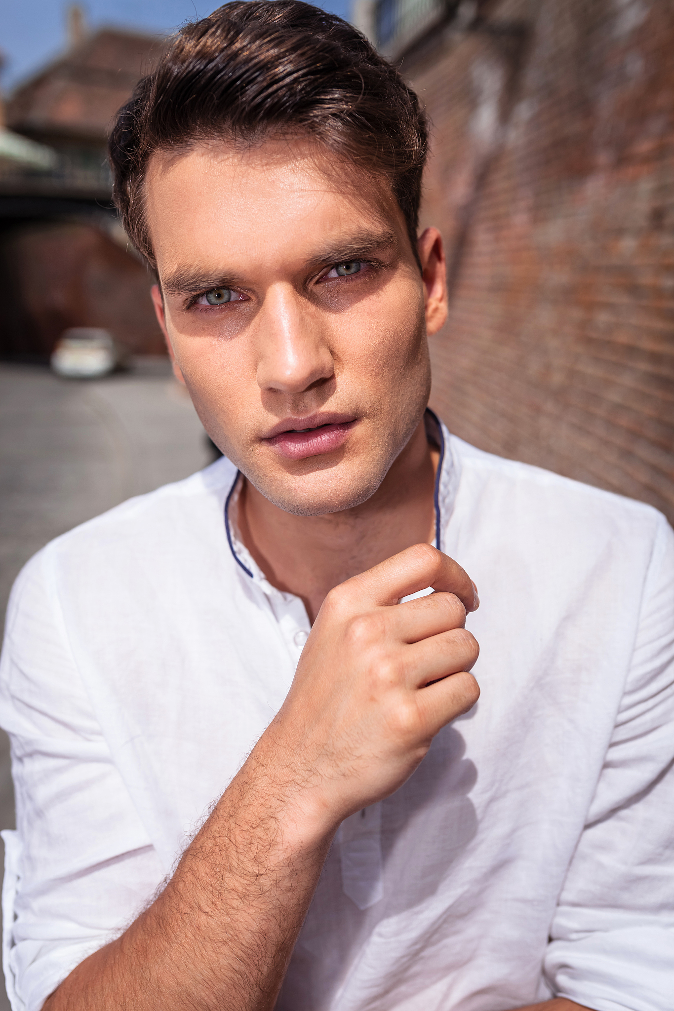 handsome young casual man looking at the camera.