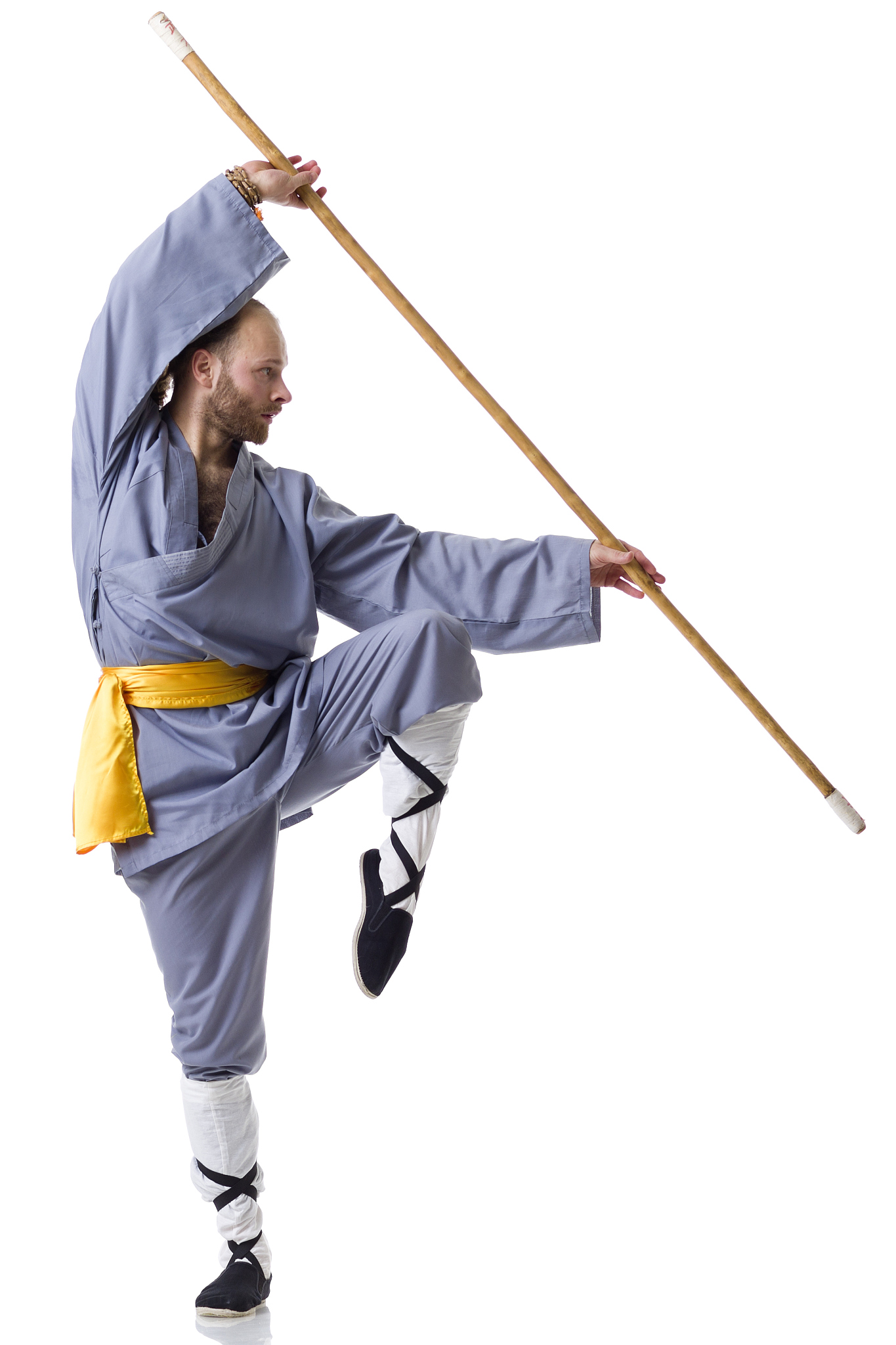 kung fu fighting position with wushu cudgel isolated on white