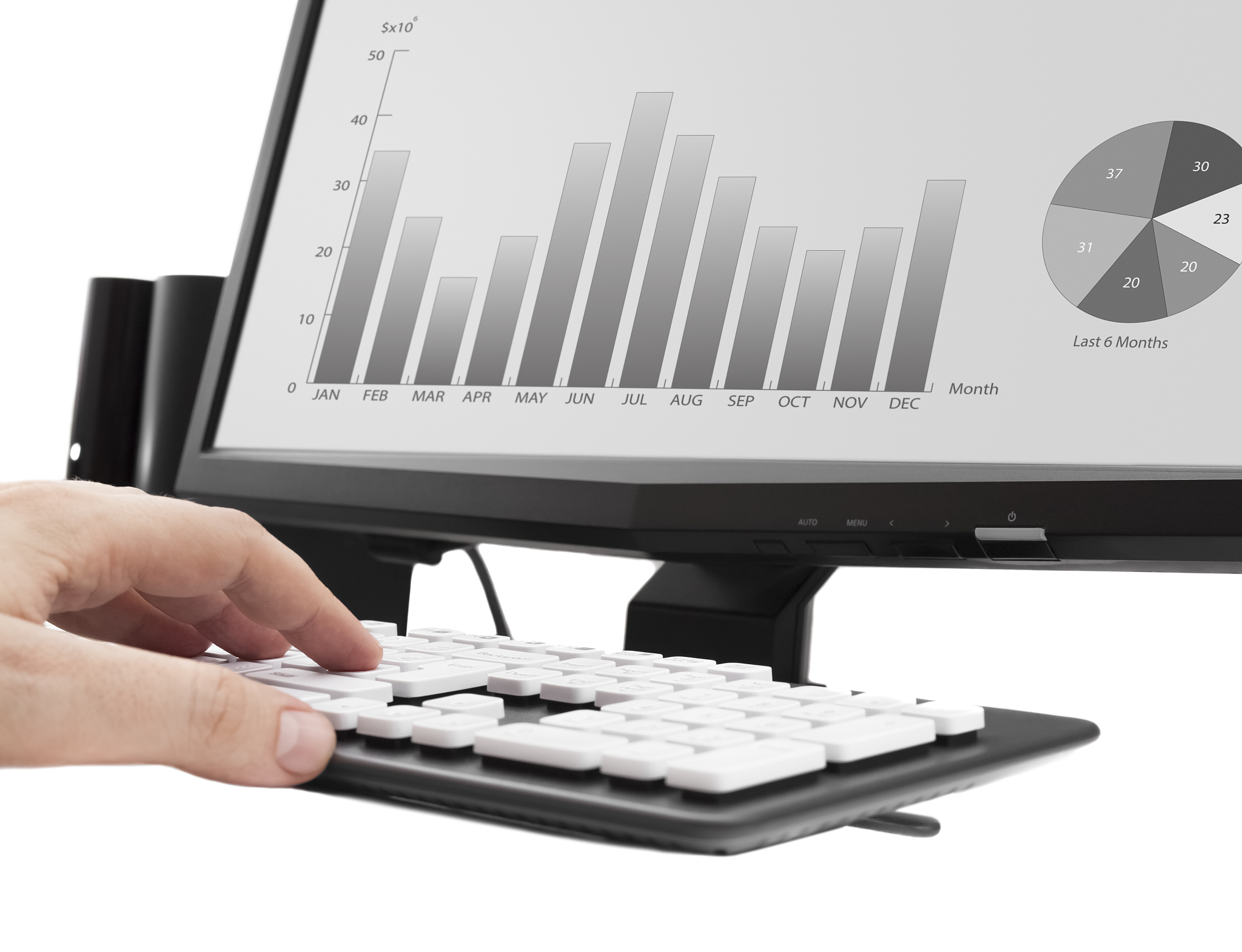 working on office computer. income analysis graphics on computer