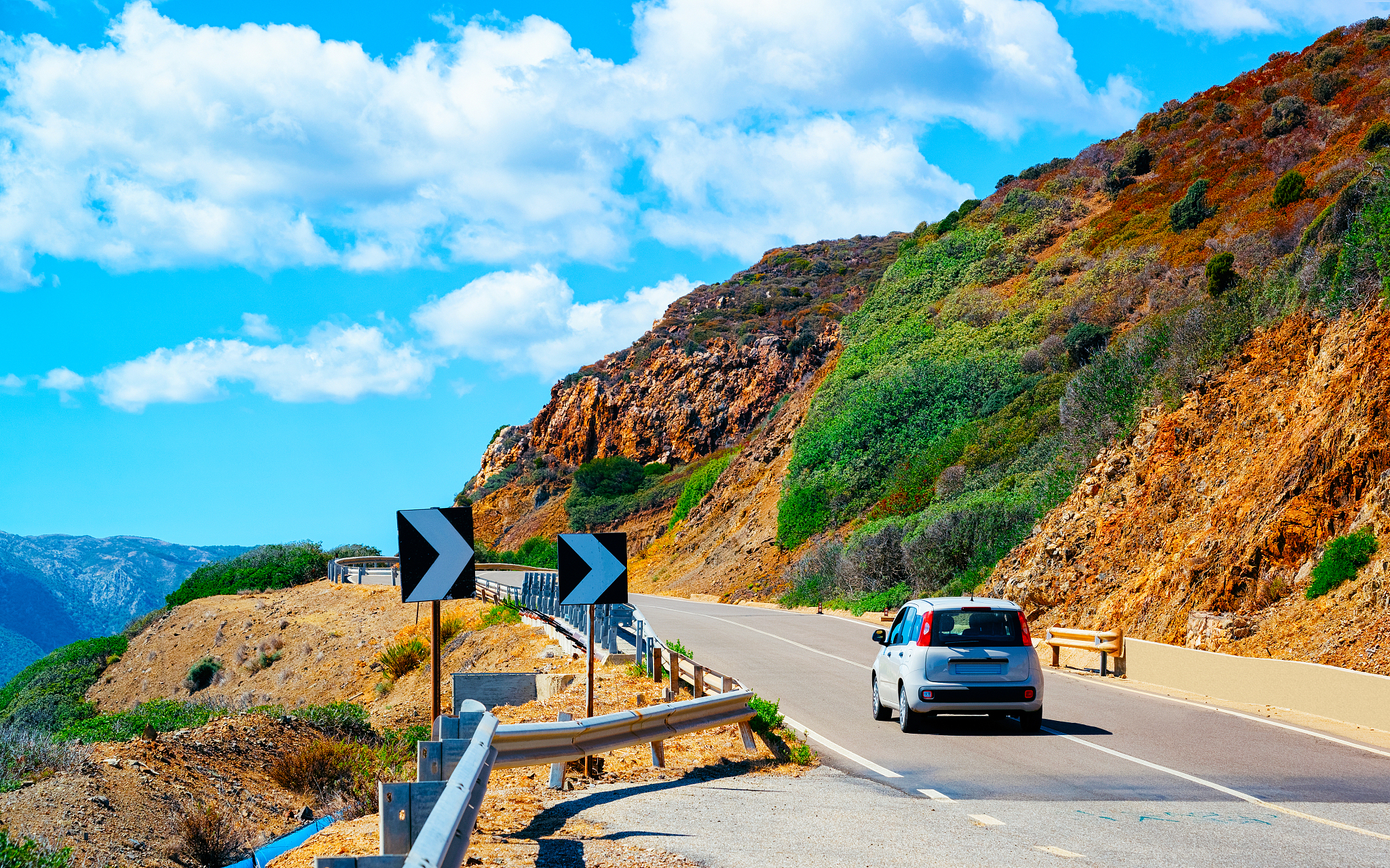 car at road in costa smeralda in sardinia island hills reflex