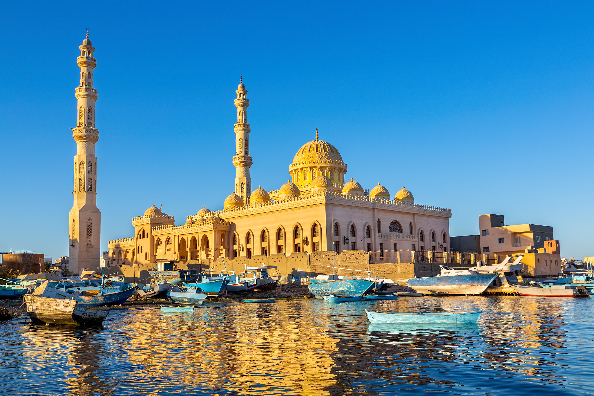 mosque with fishing boats at sea in egypt