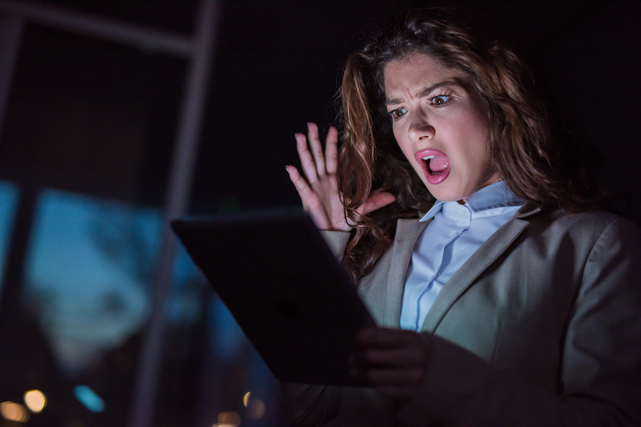 frustrated mid adult businesswoman working late night on her dig