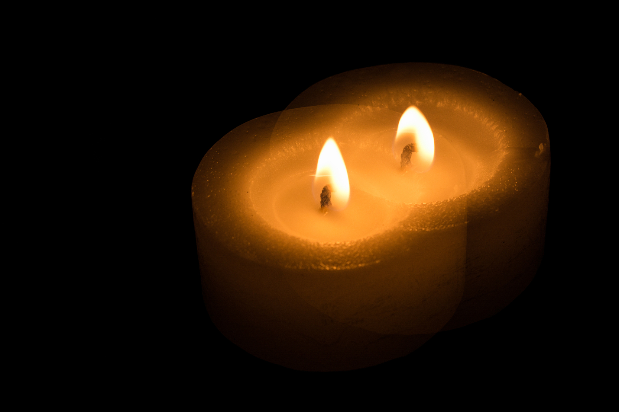candle burns at dusk, a candle fire on a black background