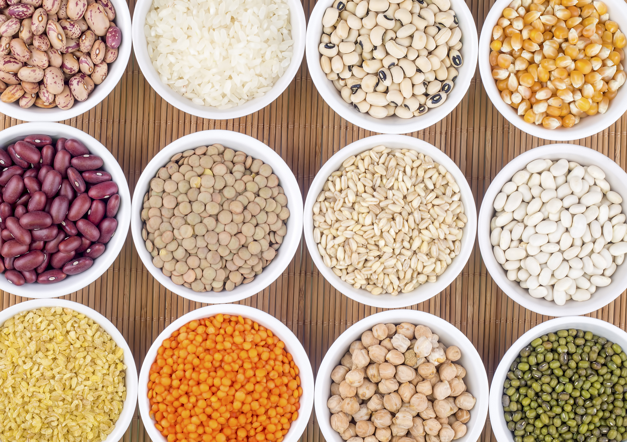 mixed dried legumes and cereals isolated on white background, to
