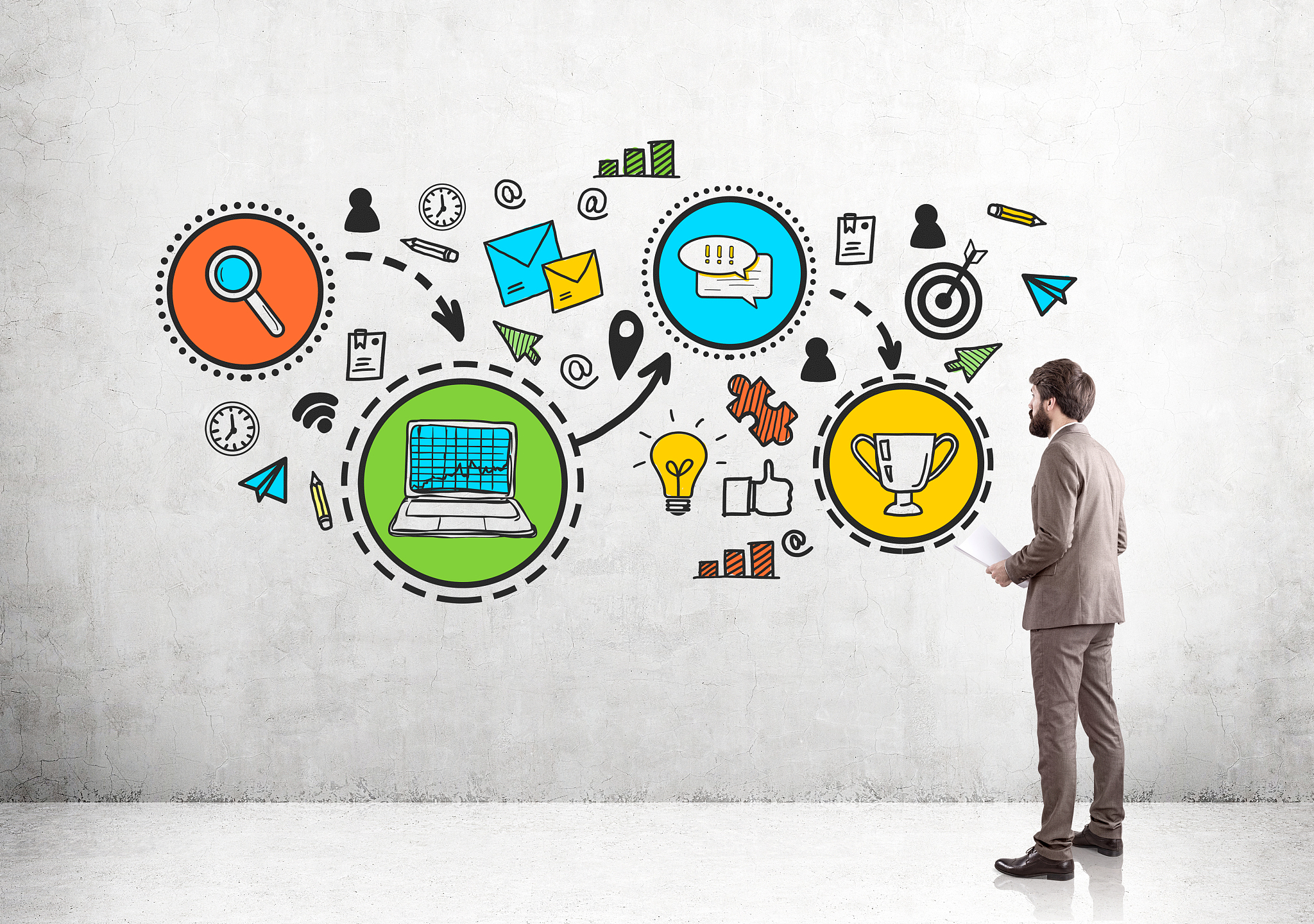 businessman in beige and colorful trophy icons
