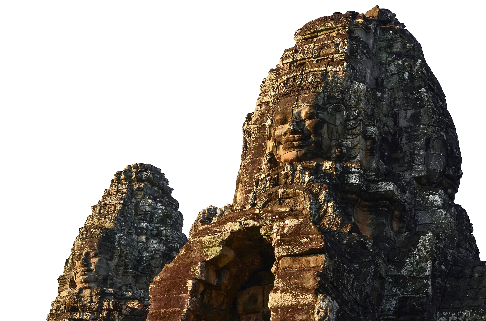 faces of ancient bayon temple at siem reap in cambodia with whit