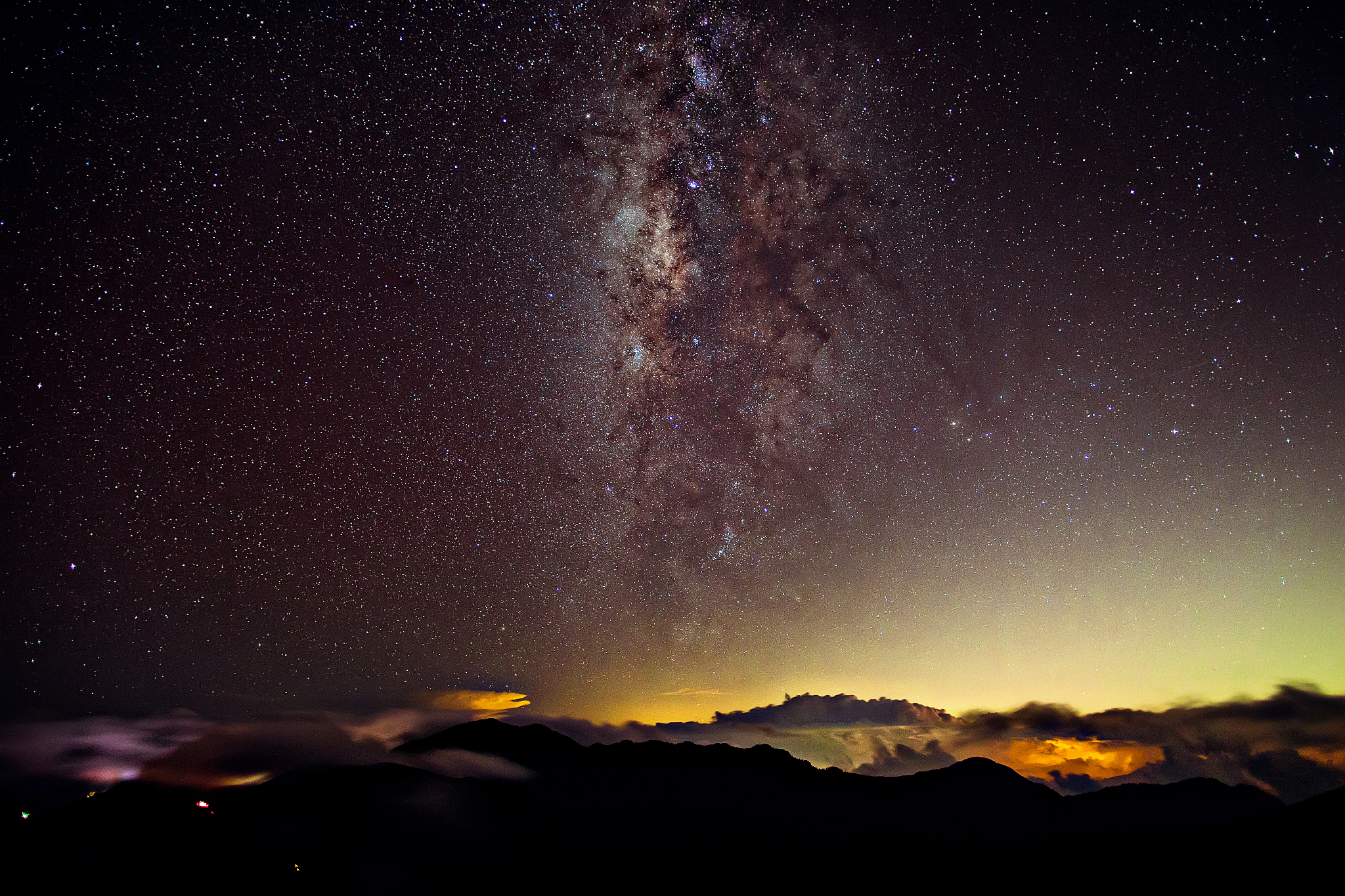 silhouette landscape against star field