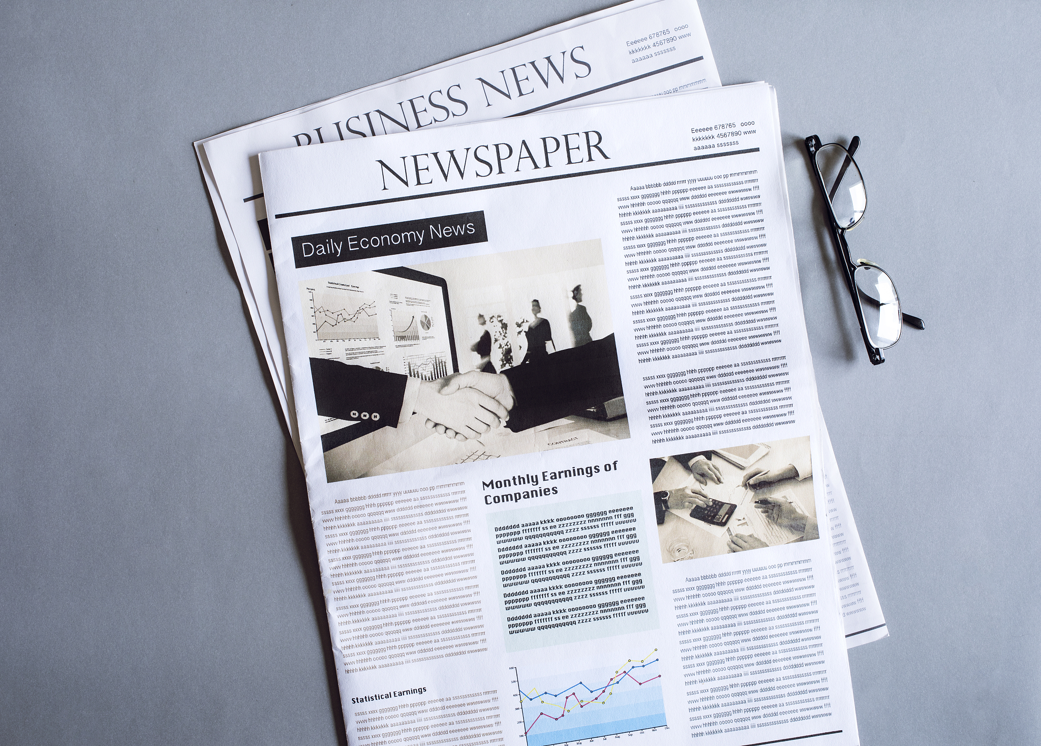 reading newspaper on desk