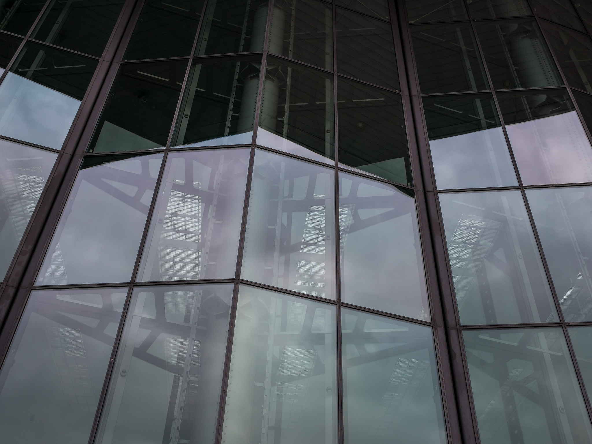 the glass architecture in city against a sky