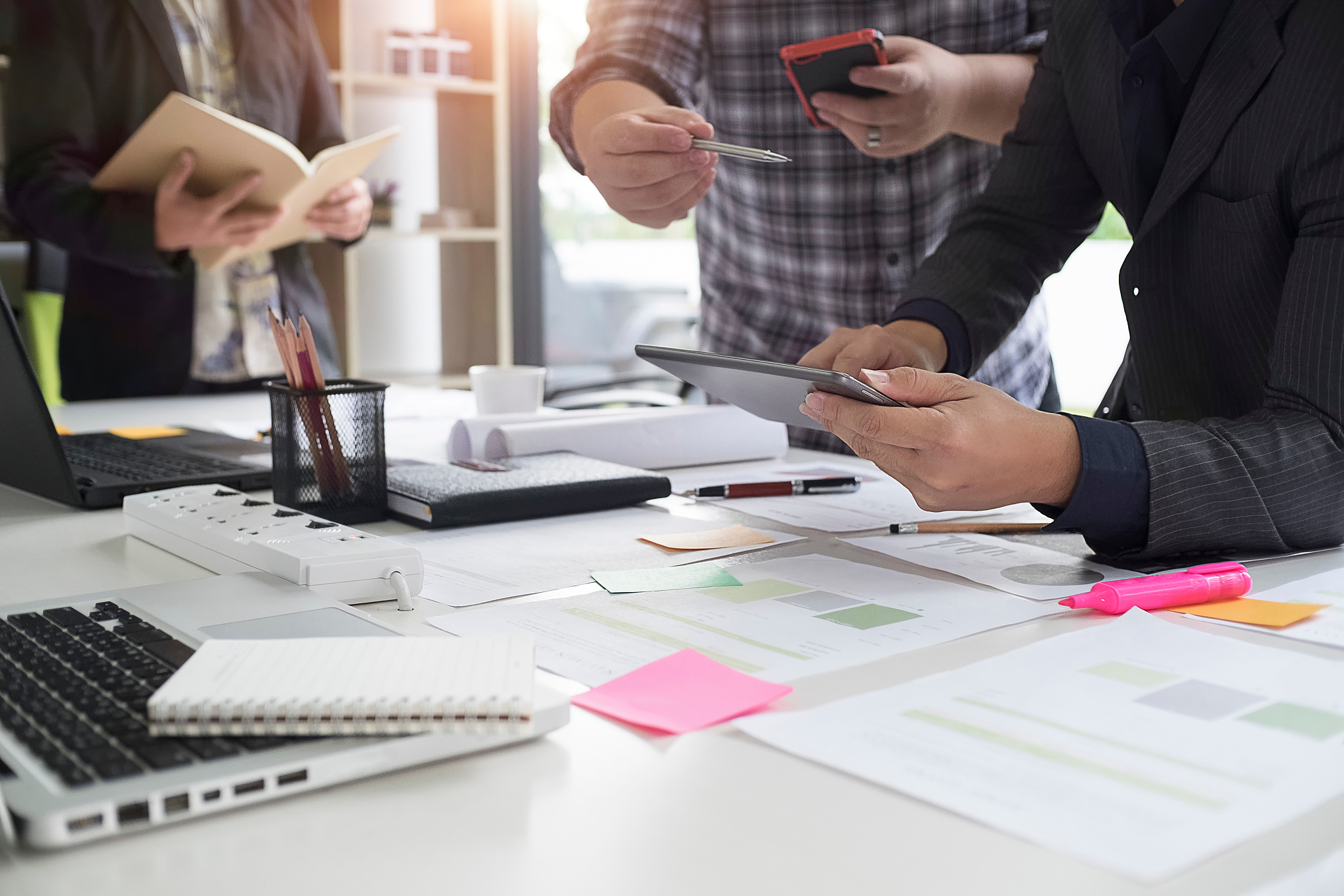 business people working by desk at office