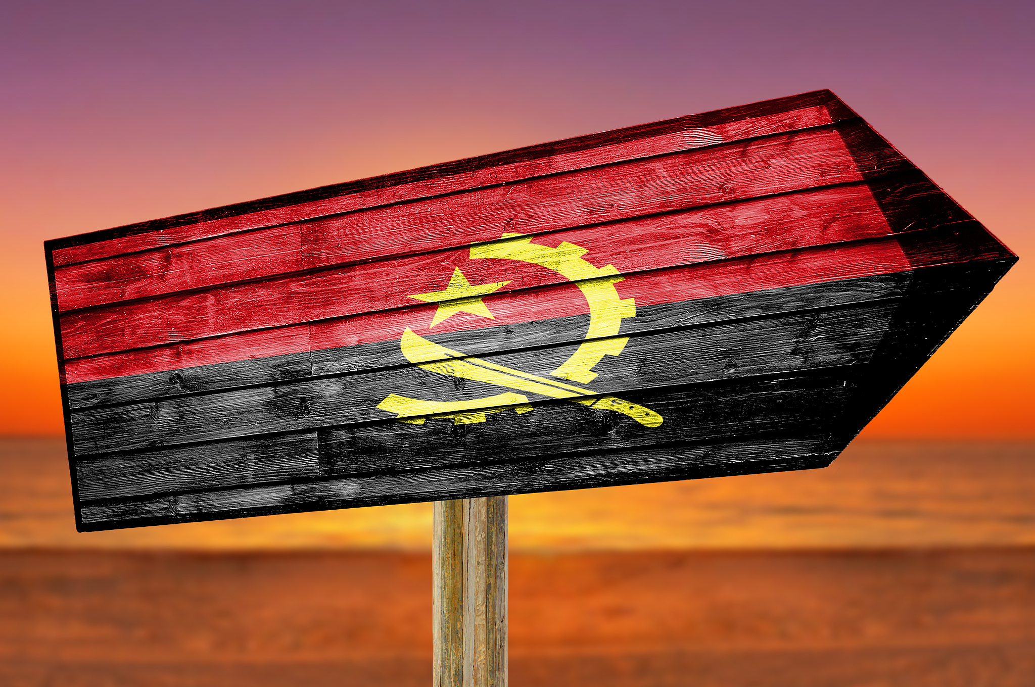 angola flag wooden sign on beach background