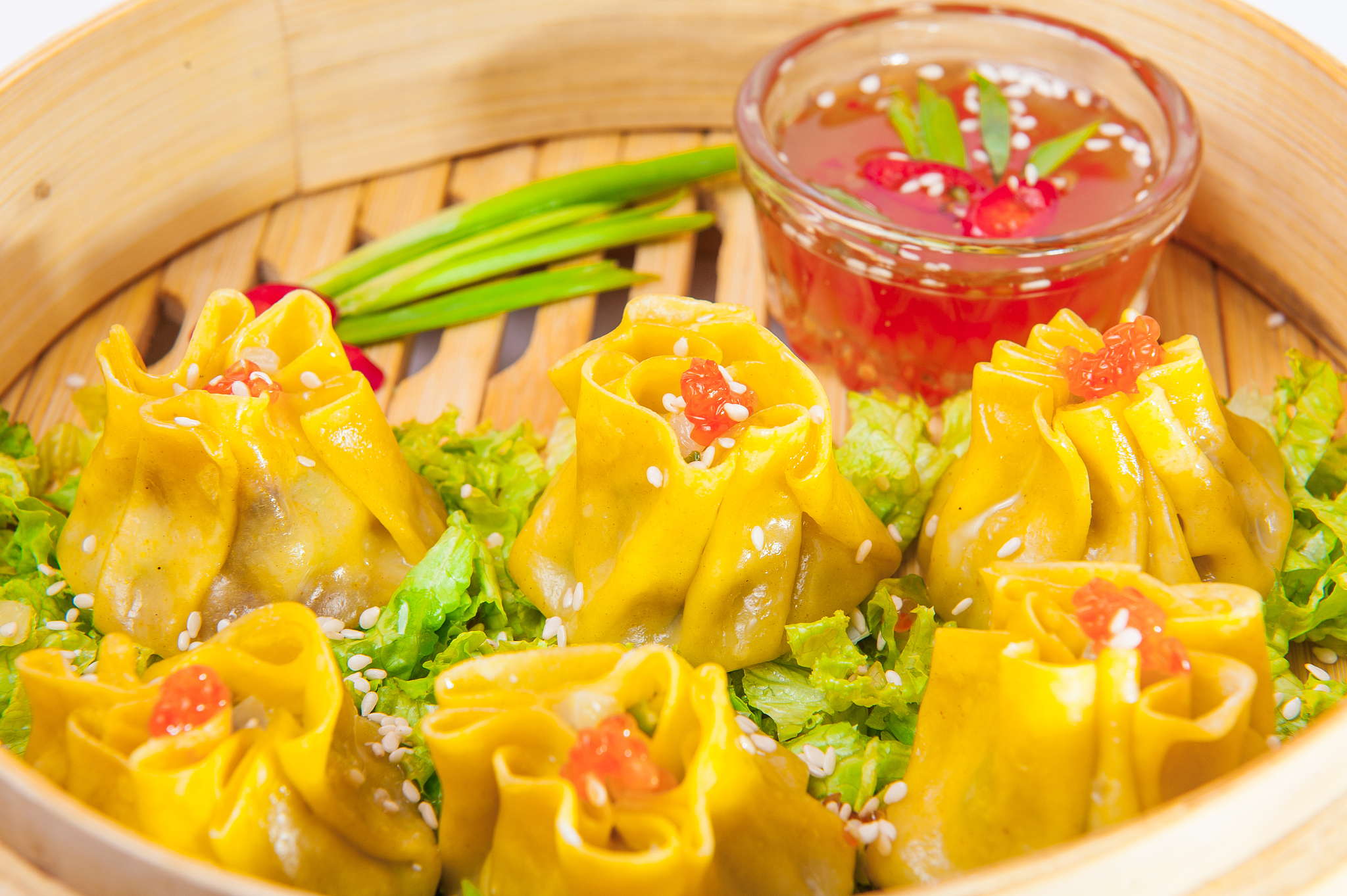 close up various dim sum and sauce in bamboo steamer on the whit