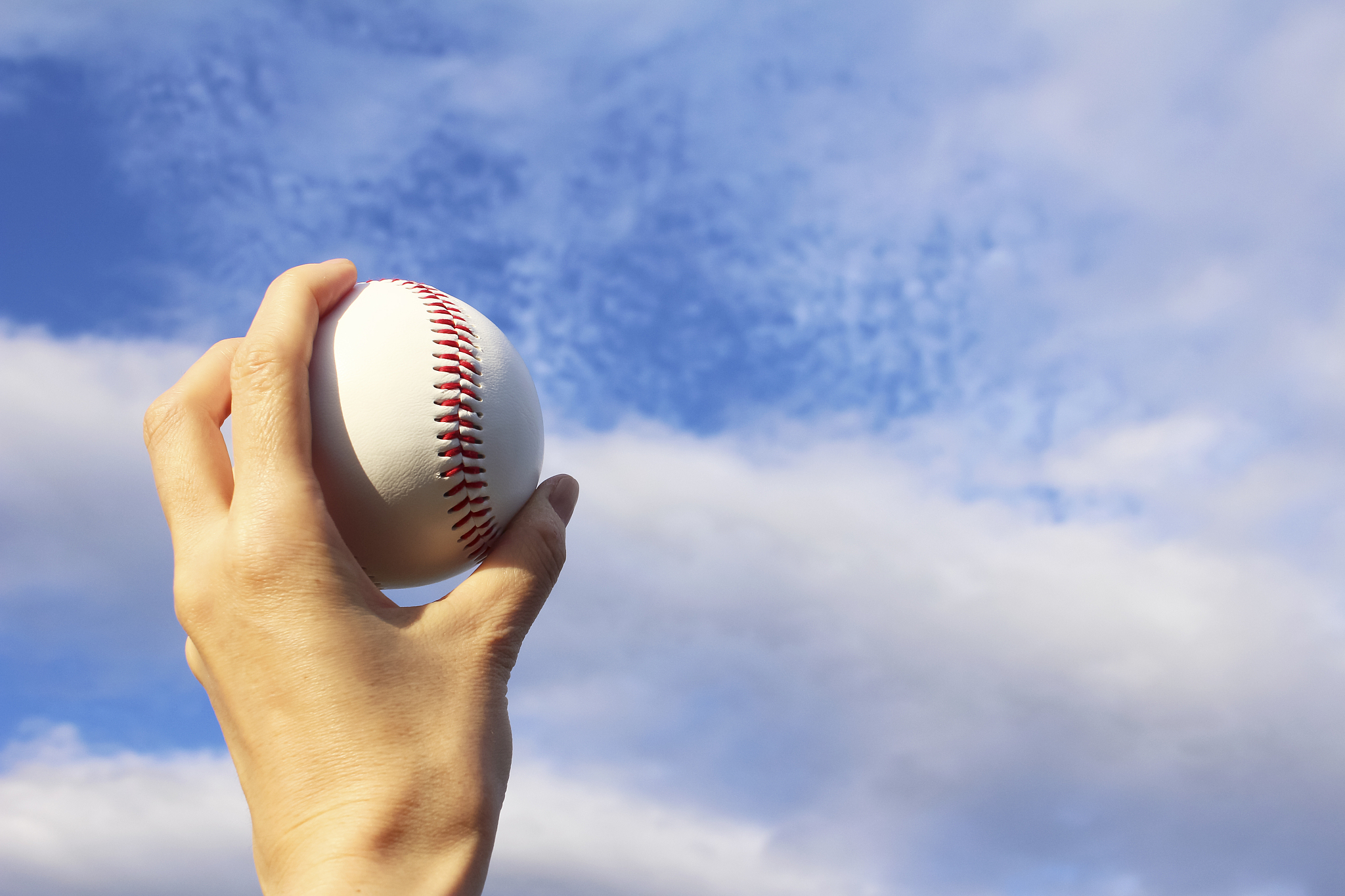 baseball field and a ball and a blue sky
