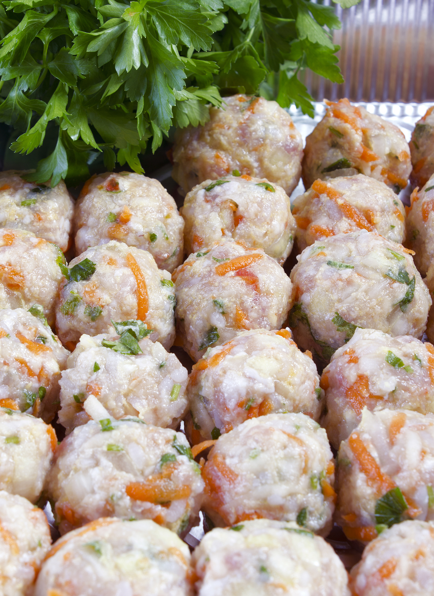 raw meatballs on pan