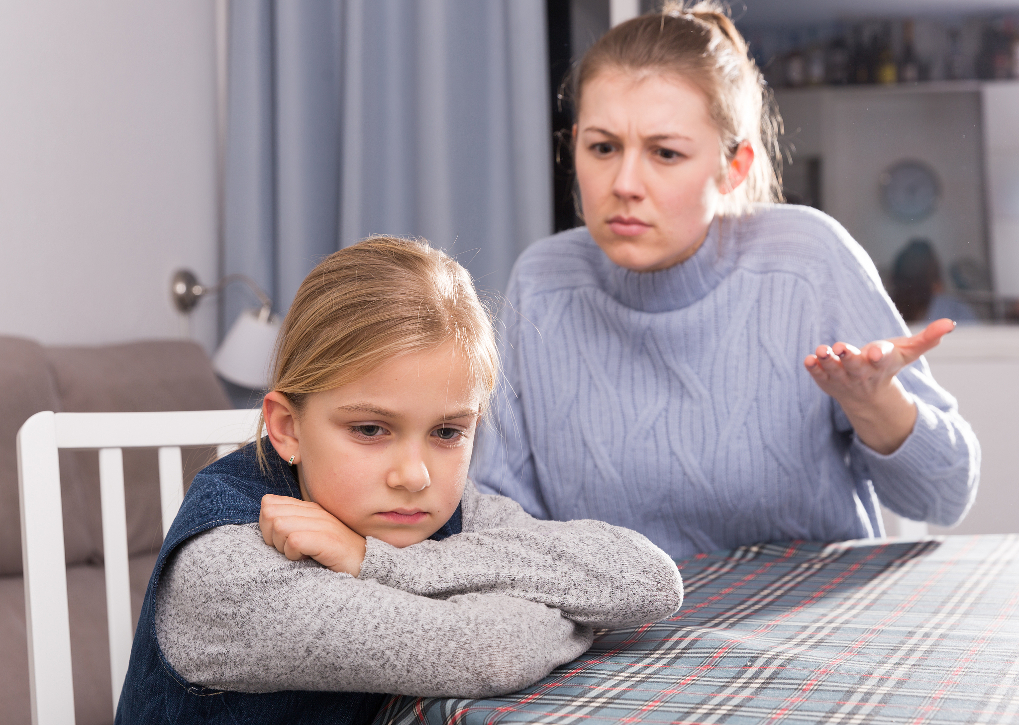 mom scolds little daughter. crisis of motherhood