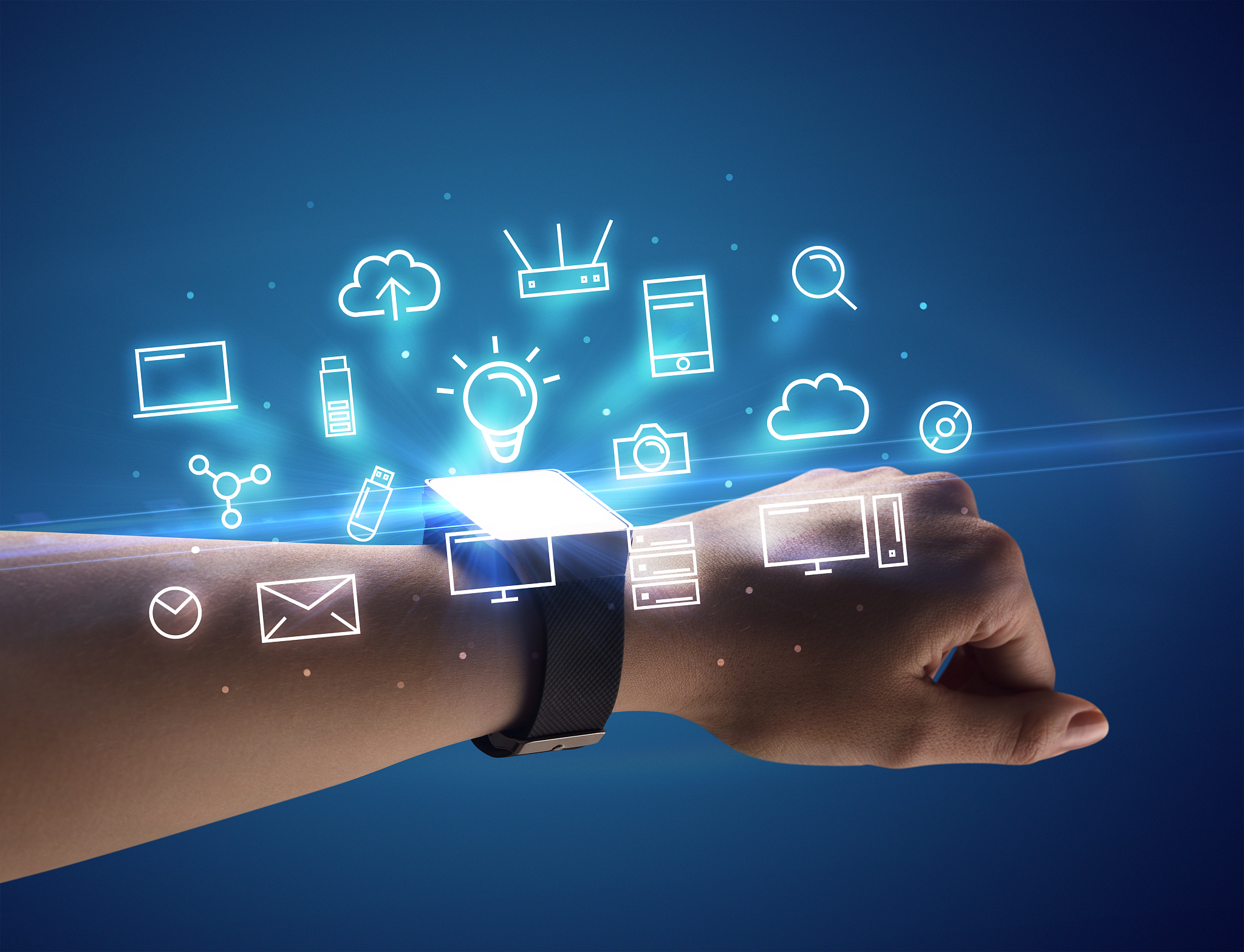 hand wearing smartwatch with multimedia symbols