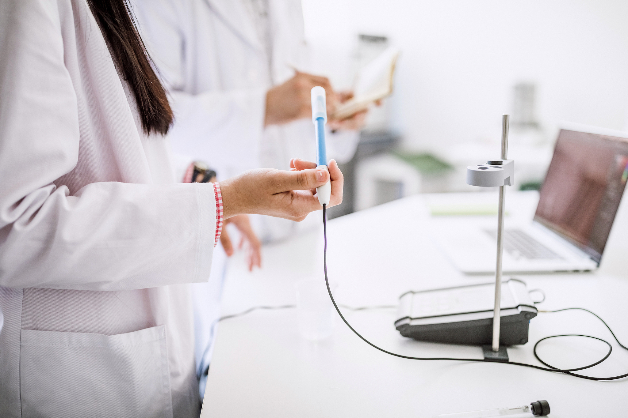 young chemical technicians testing chemicals
