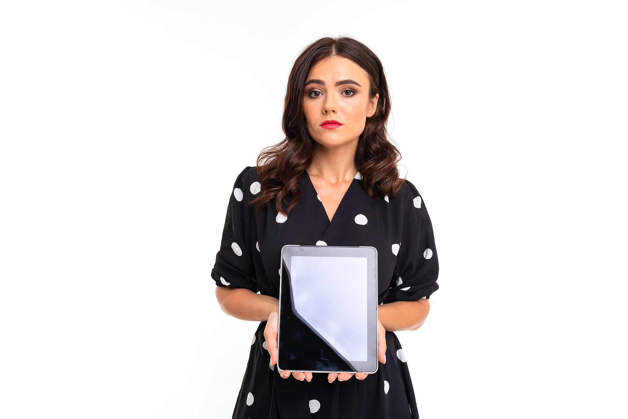 attractive girl holding a tablet with mockup in her hands with t