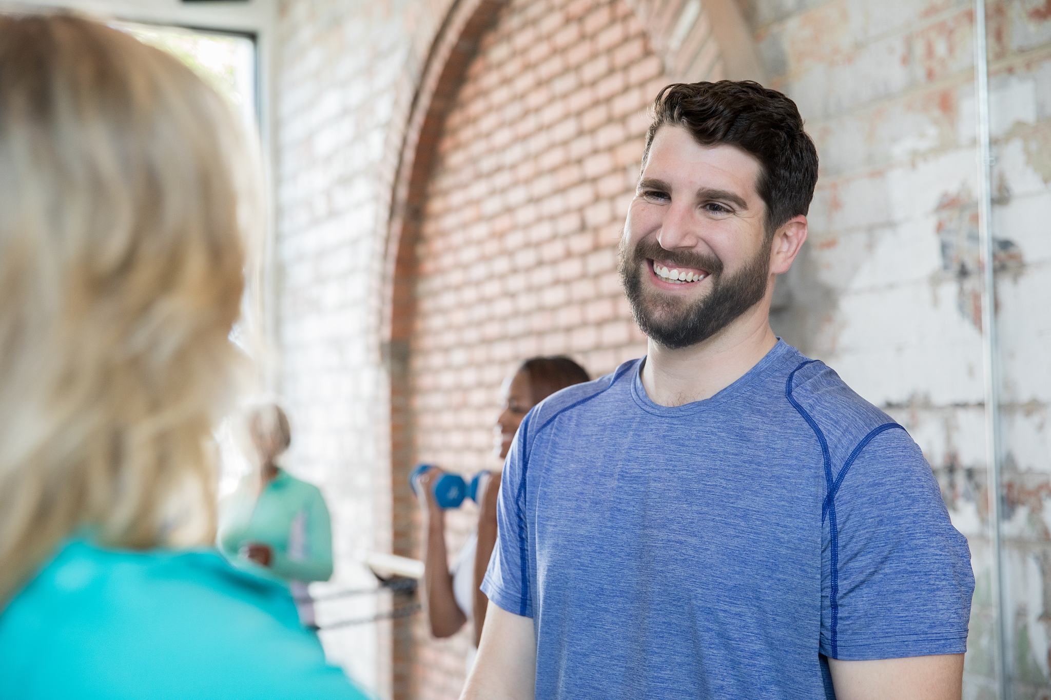 fitness instructor smiling at client