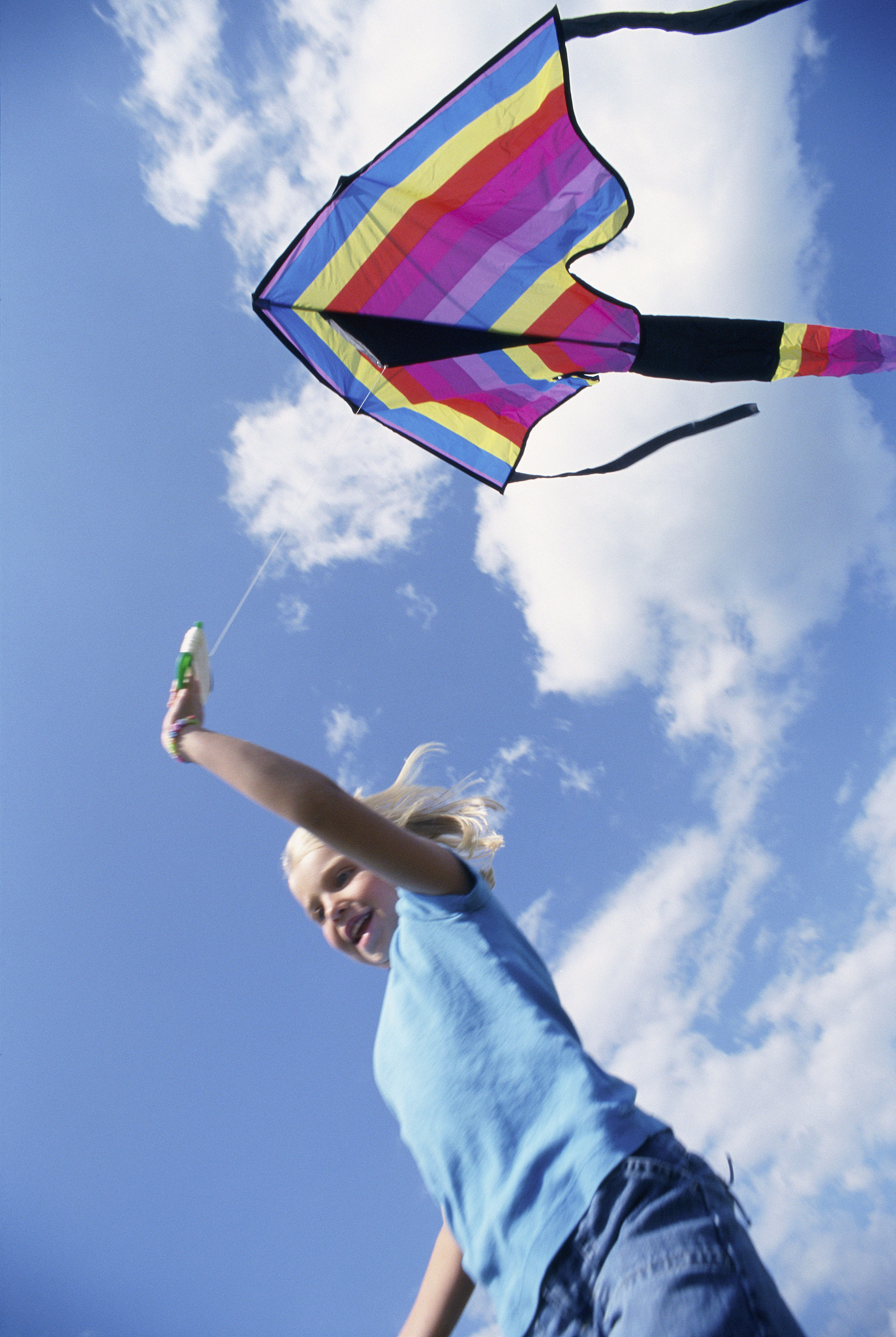 girl playing with kite