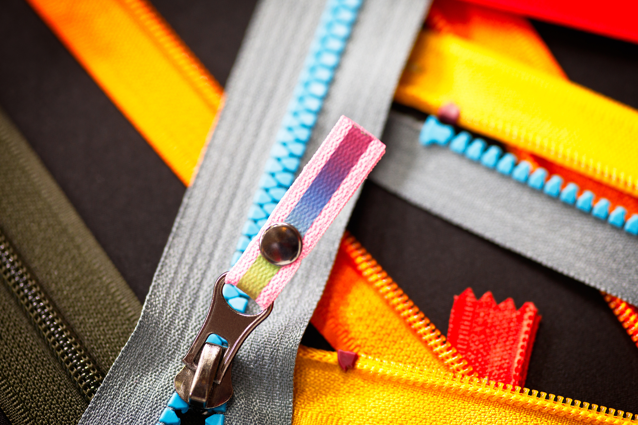 zip background texture of zippers sliders. a lot of zippers in d