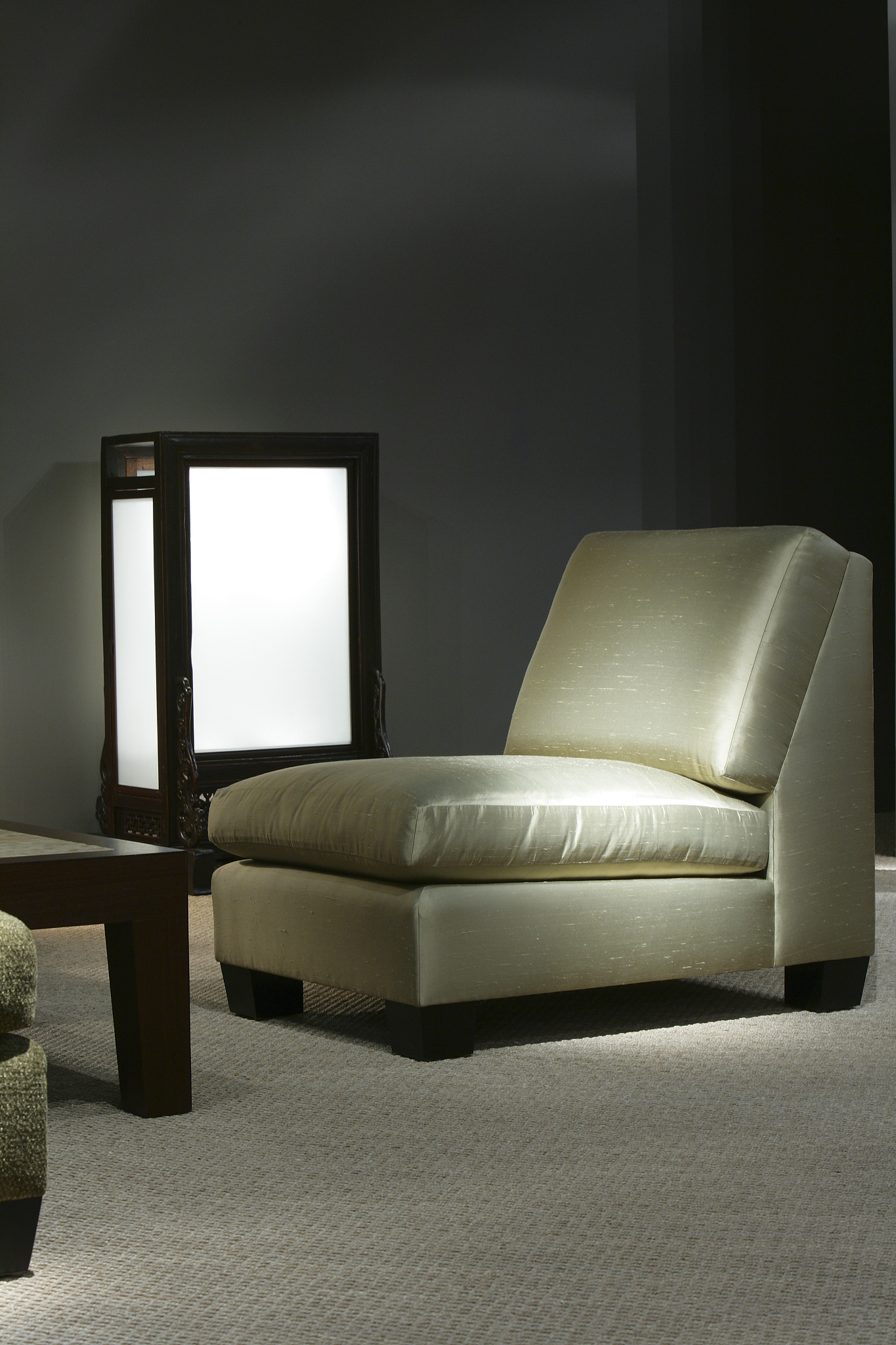 pale green chair beside black and white lamp