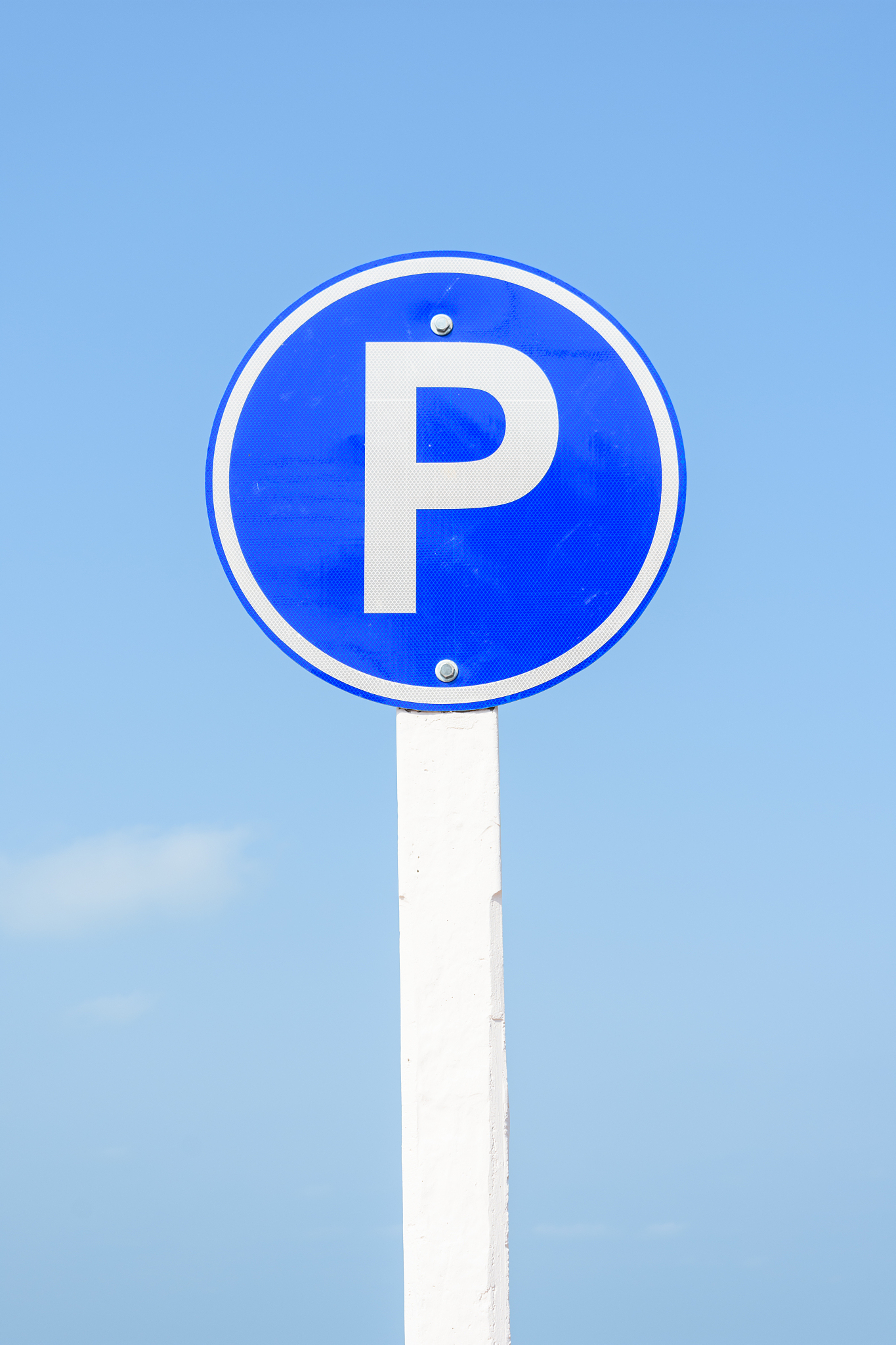 low angle view of road sign against blue sky