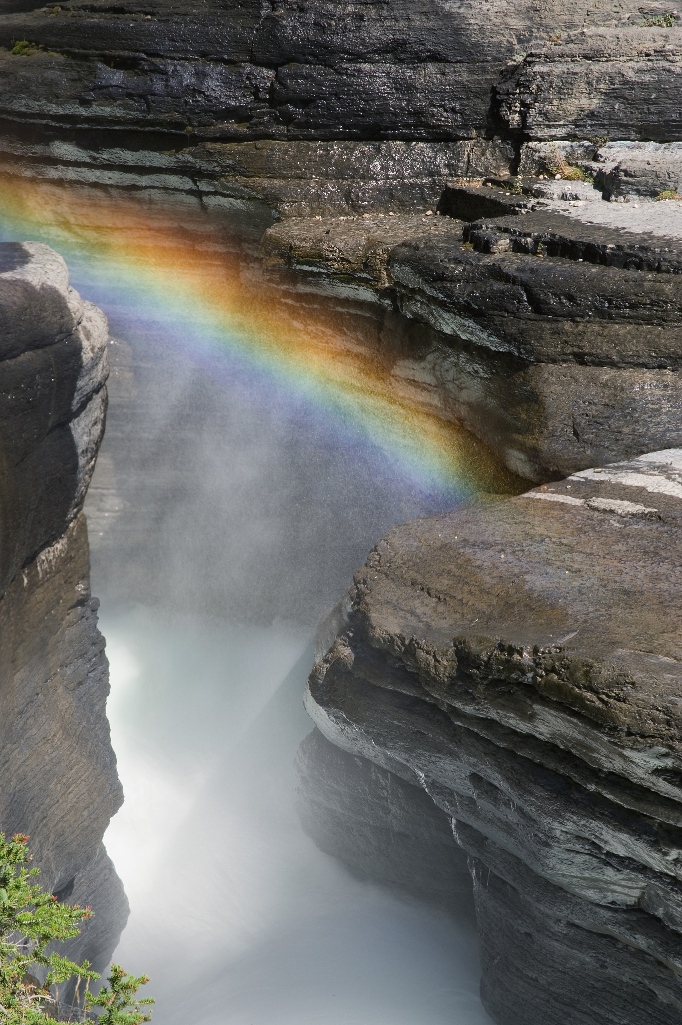 rainbow over mistaya river, mistaya canyon, alberta, canada